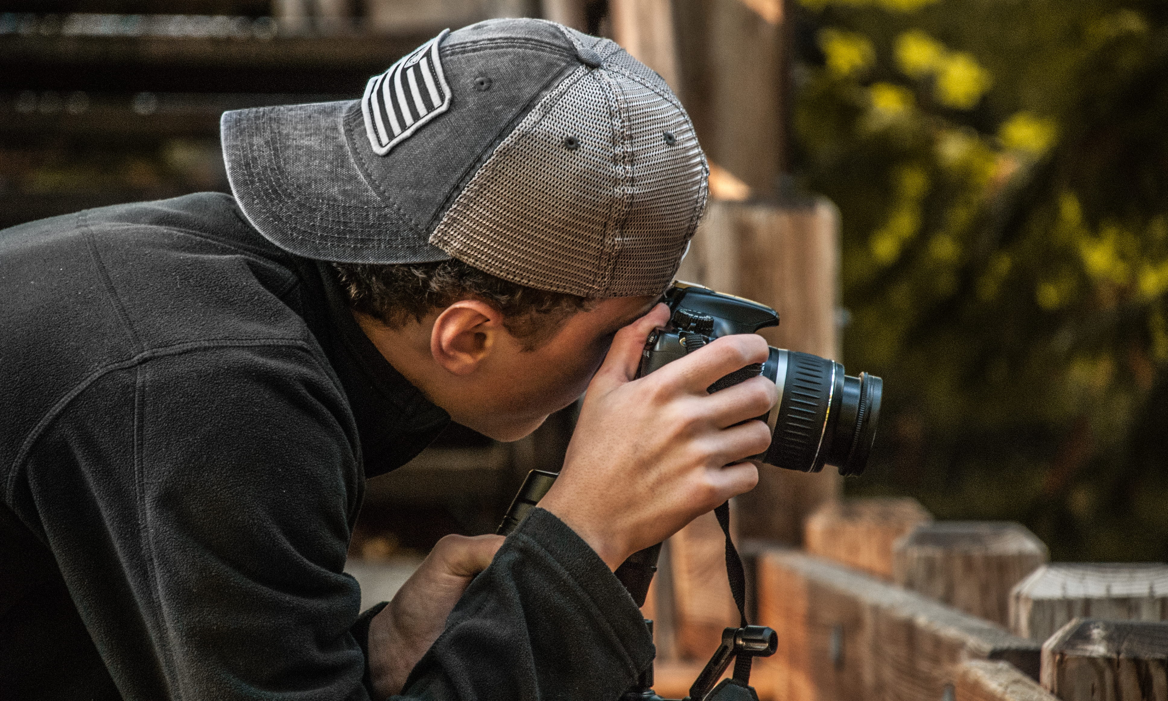 camera equipment, activity, cap, trees, camera, dslr, street, men, clothing, young adult, hat, casual, portrait, wear, field, male, depth of field, headshot, HD Wallpaper
