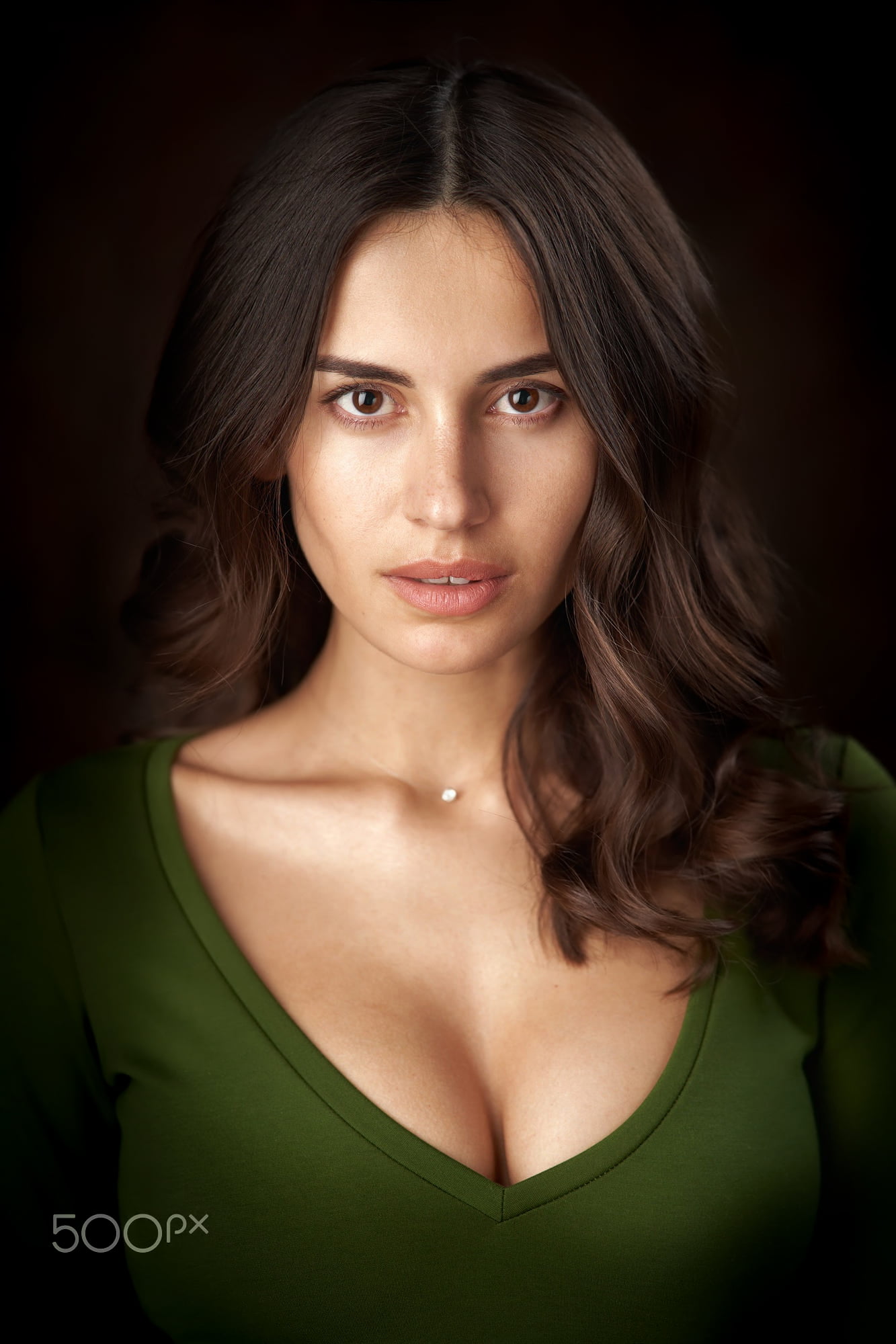 women, wavy hair, simple background, 1080P, green clothing, looking at viewer, brunette, Alexander Vinogradov, blouse, long hair, makeup, portrait, Phone HD Wallpaper