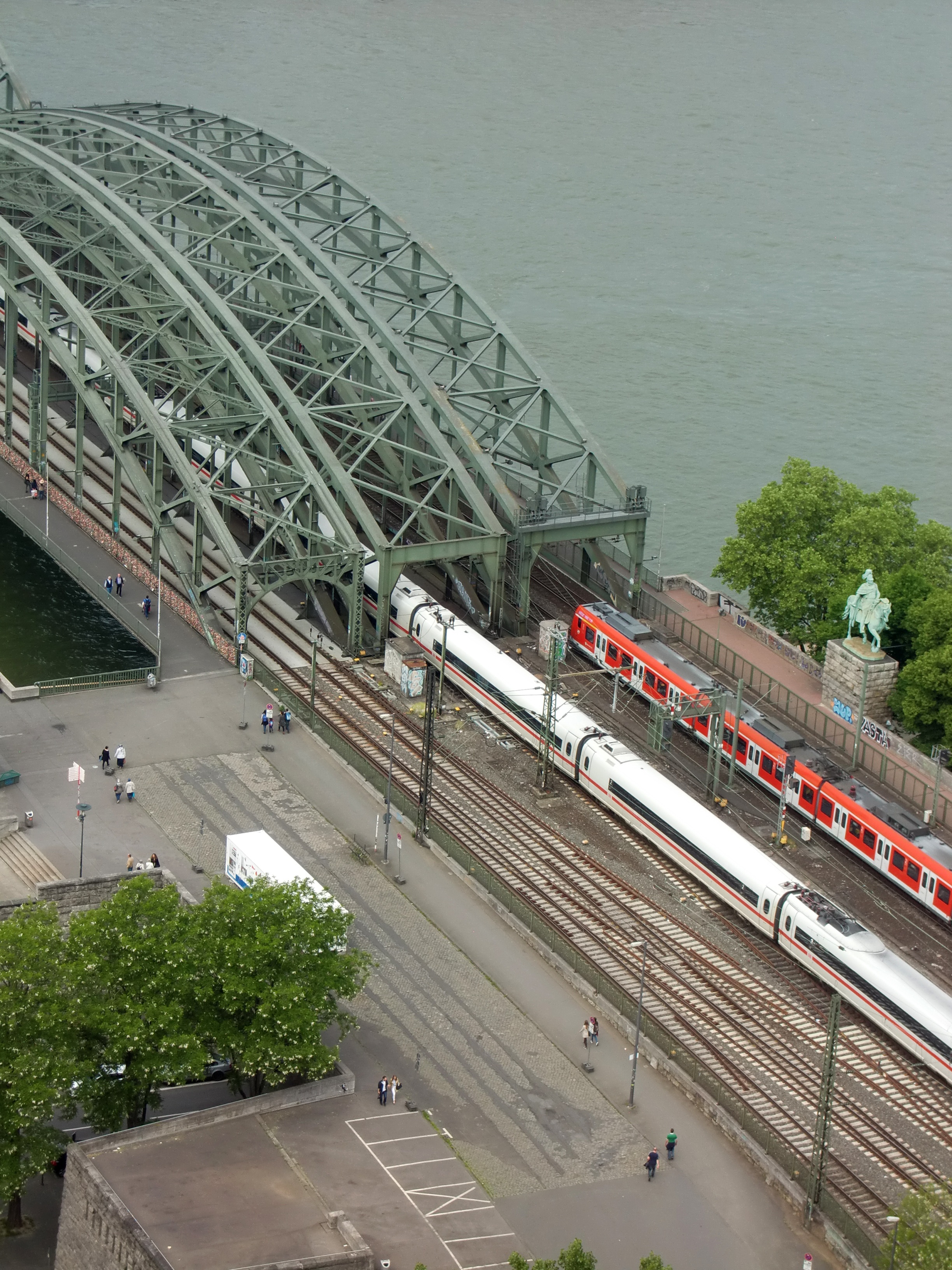 architecture, high angle view, track, land vehicle, river, plant, historic preservation, metal rods, hohenzollern bridge, railway bridge, train, city, incidental people, Phone HD Wallpaper