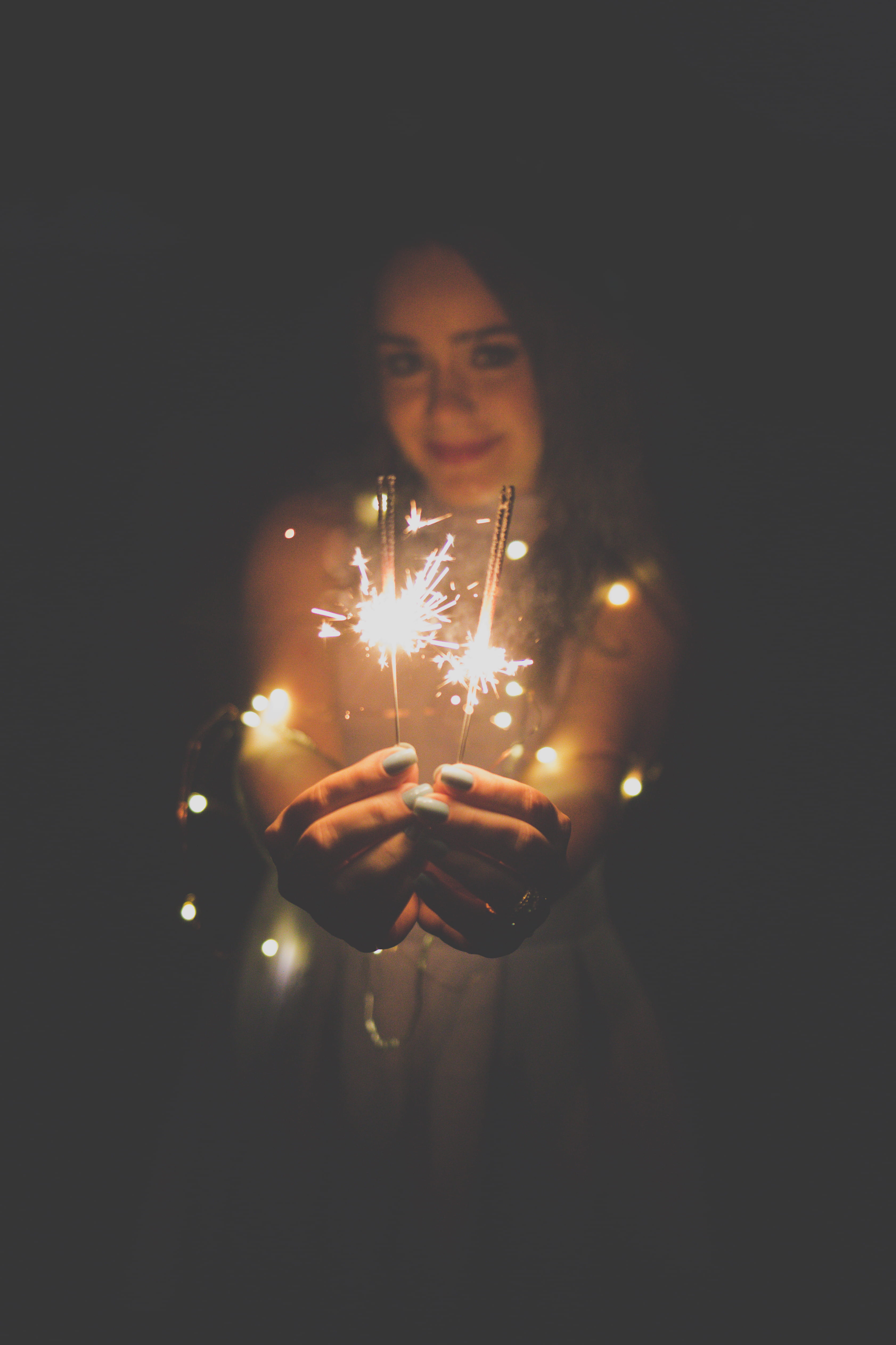 one person, adult, sparkler, portrait, lifestyles, young adult, real people, wearing, 4K, studio shot, sticks, light, indoors, black, lighting equipment, Phone HD Wallpaper
