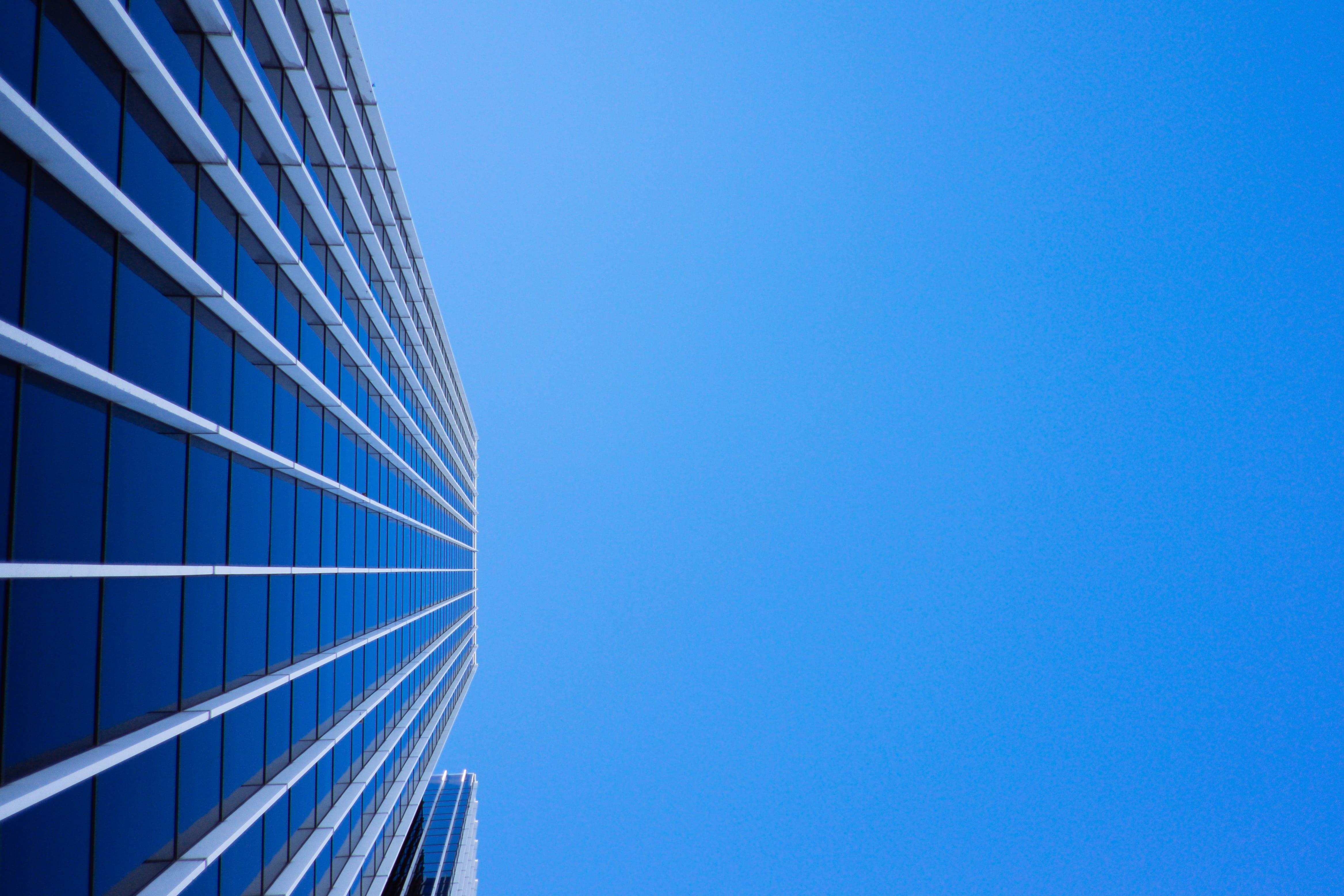 clear sky, low angle view, sunny, glass - material, blue, business, building exterior, corporate, modern, city, no people, sunshine, outdoors, 4K, office, HD Wallpaper
