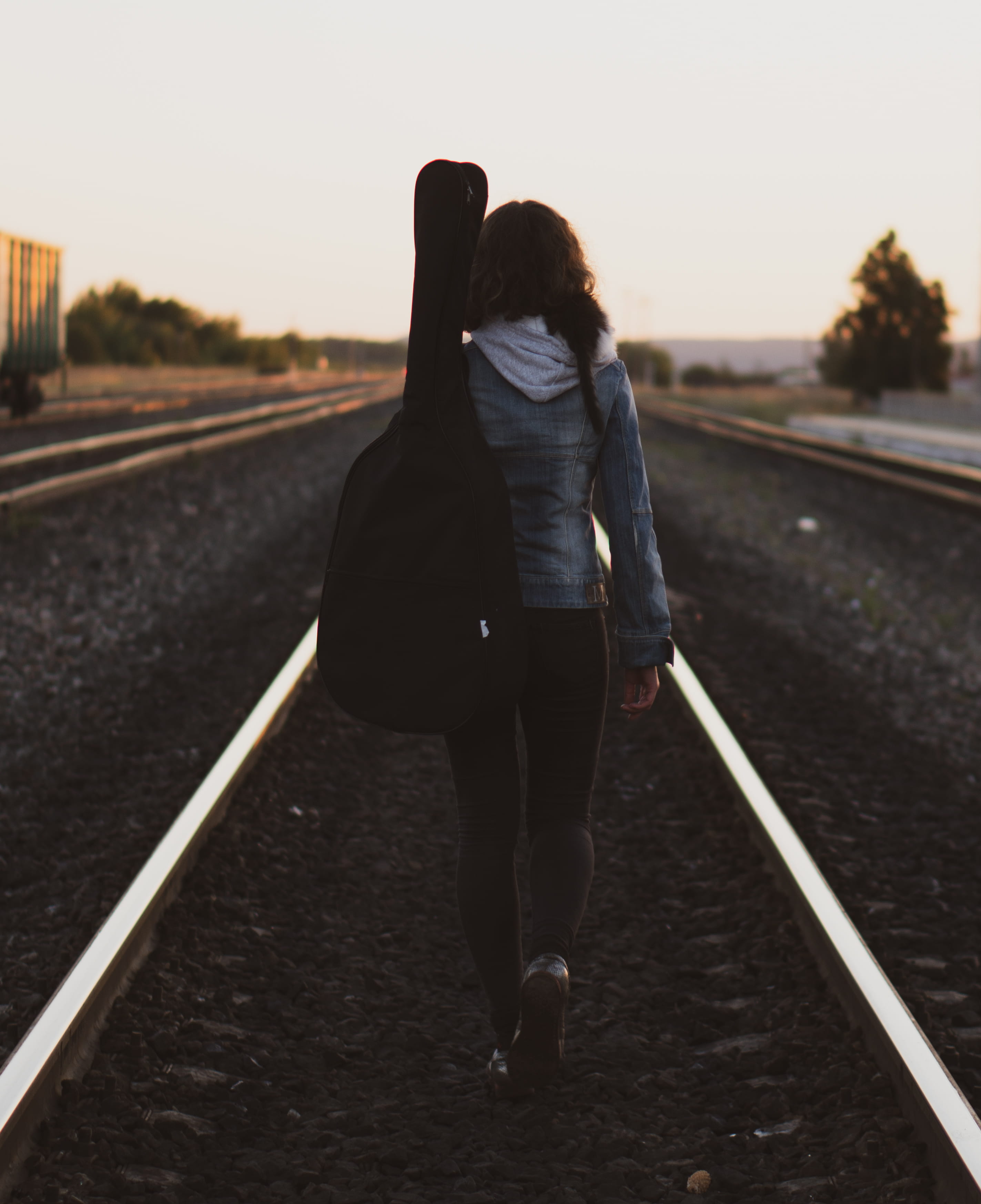 train station, nature, locomotive, lifestyles, sunset, one person, transportation, guidance, full length, rail, the way forward, guitar, real people, adult, Phone HD Wallpaper
