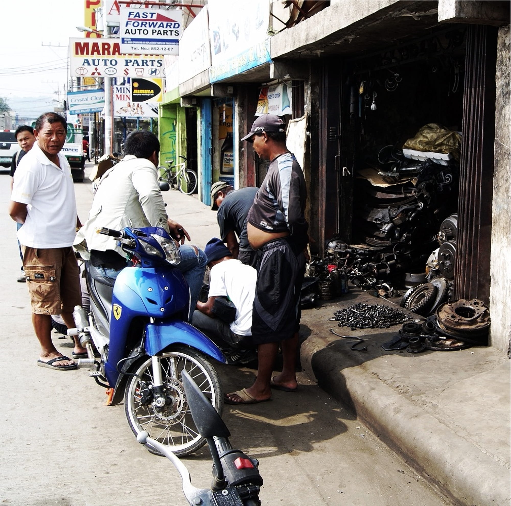 outdoors, real people, riding, land vehicle, mindanao, day, cagayandeoro, city, city life, adult, building exterior, group of people, built structure, transportation, HD Wallpaper