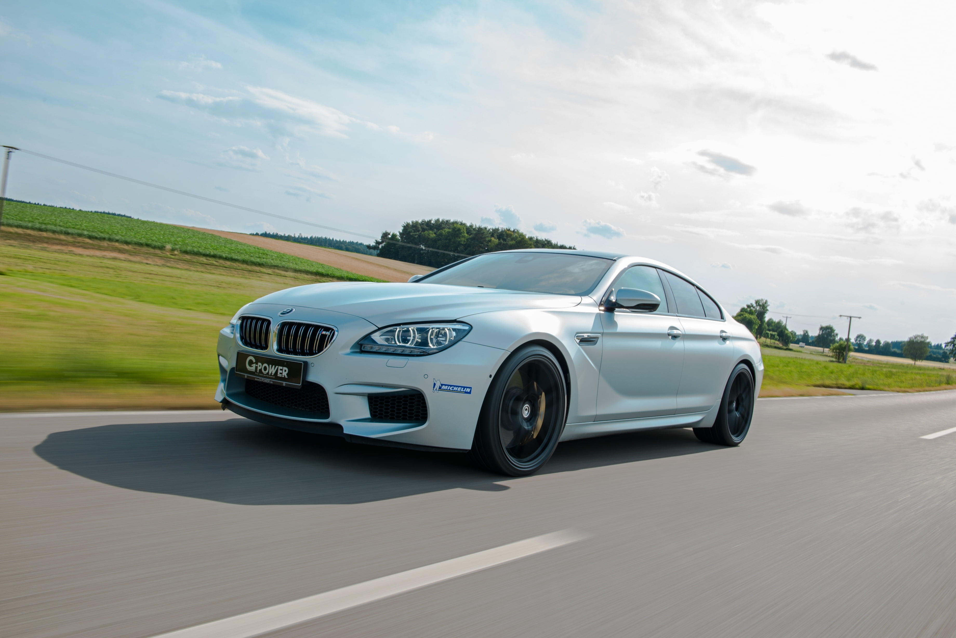 road marking, environment, technology, on the move, 2K, road trip, sports Car, speed, road, side View, cloud - sky, white, car, engine, motion, m6, transportation, HD Wallpaper