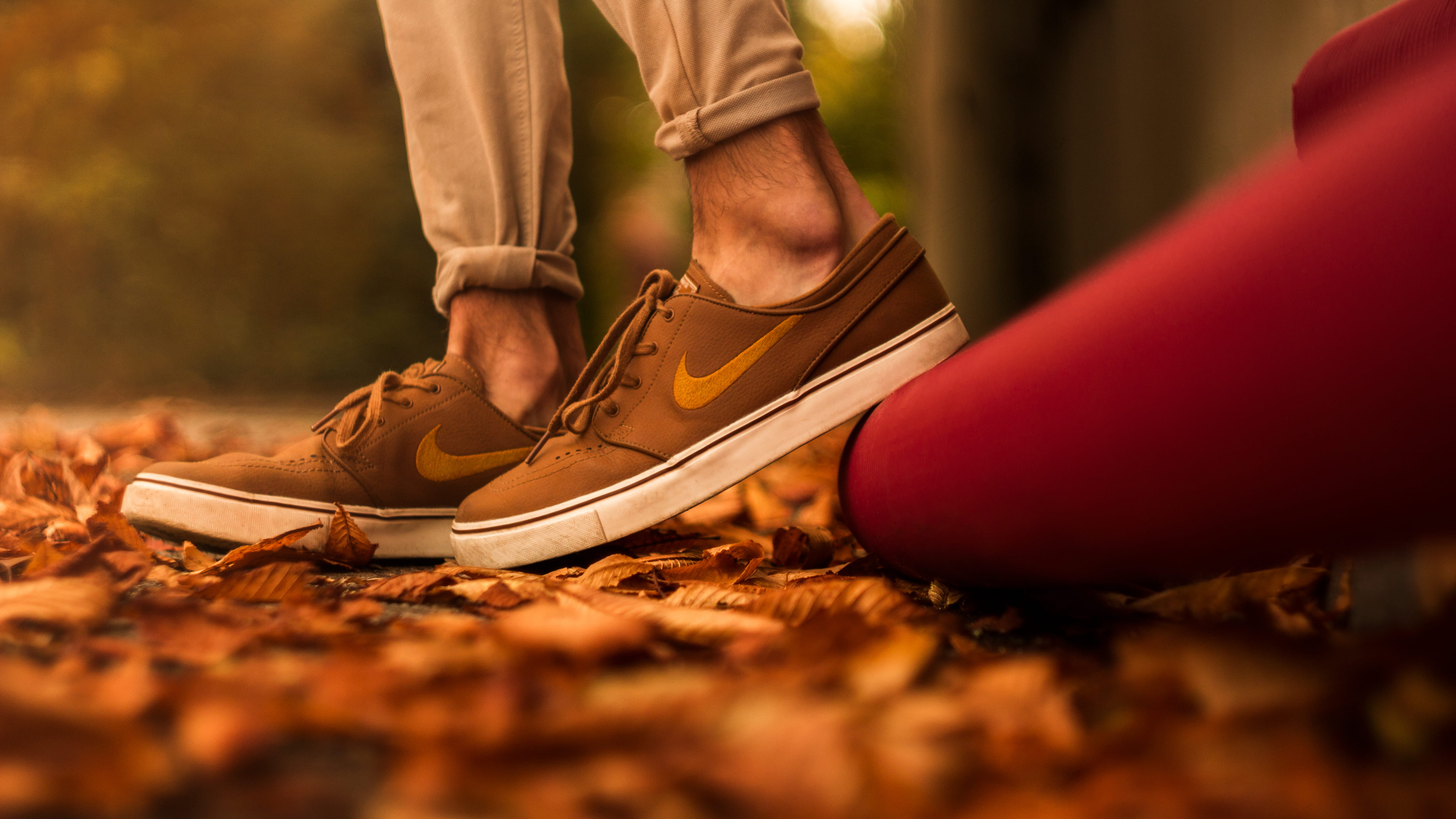 human leg, body part, angle, nike, adult, limb, shoe, human limb, autumn, selective focus, human body part, janoksi, white, close-up, nature, leaves, 5K, HD Wallpaper