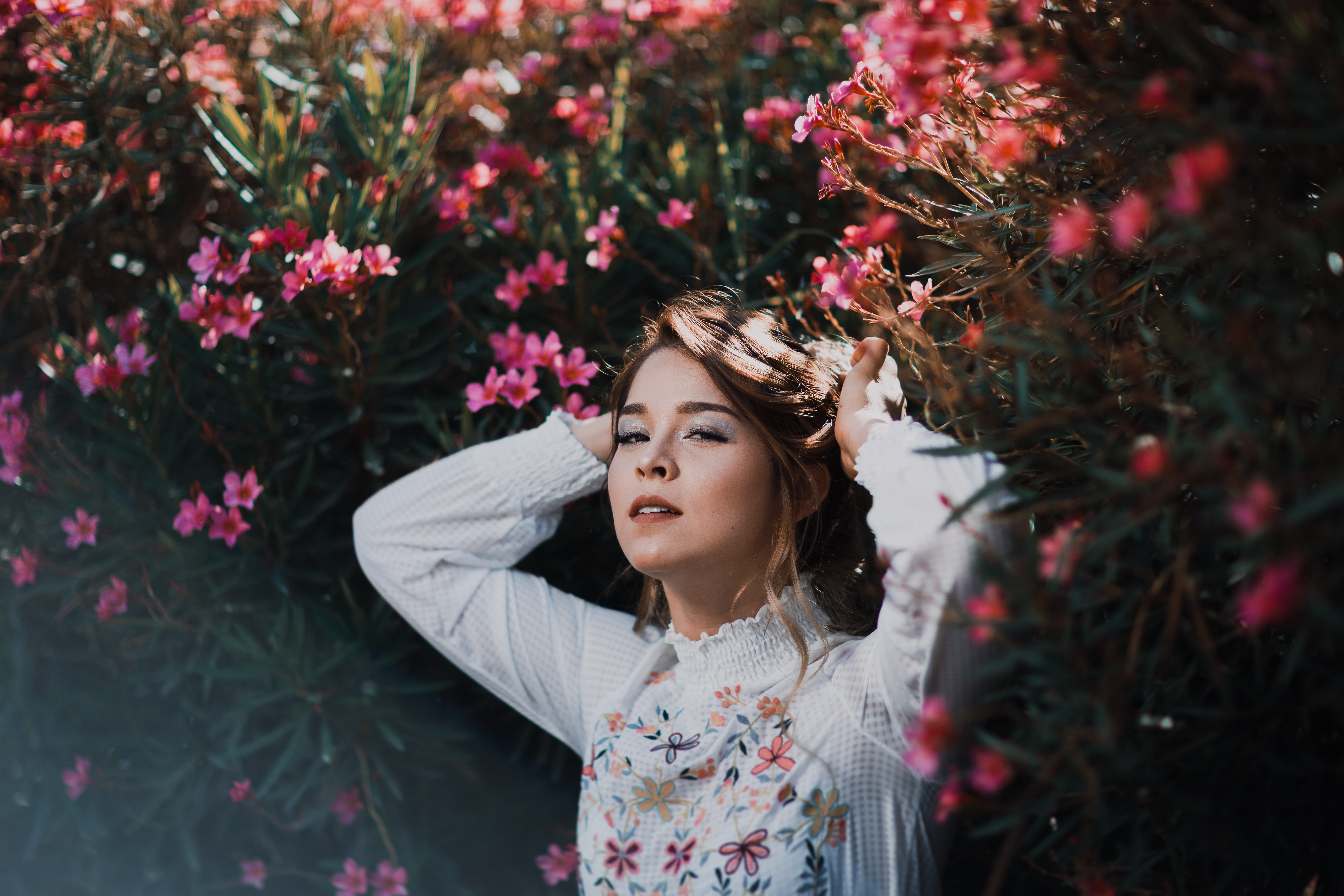 human Hair, beauty, solitude, season, enjoyment, model, pinkflower, female, white, floral, smiling, summer, looking, cute, bush, standing, tree, outdoors, HD Wallpaper
