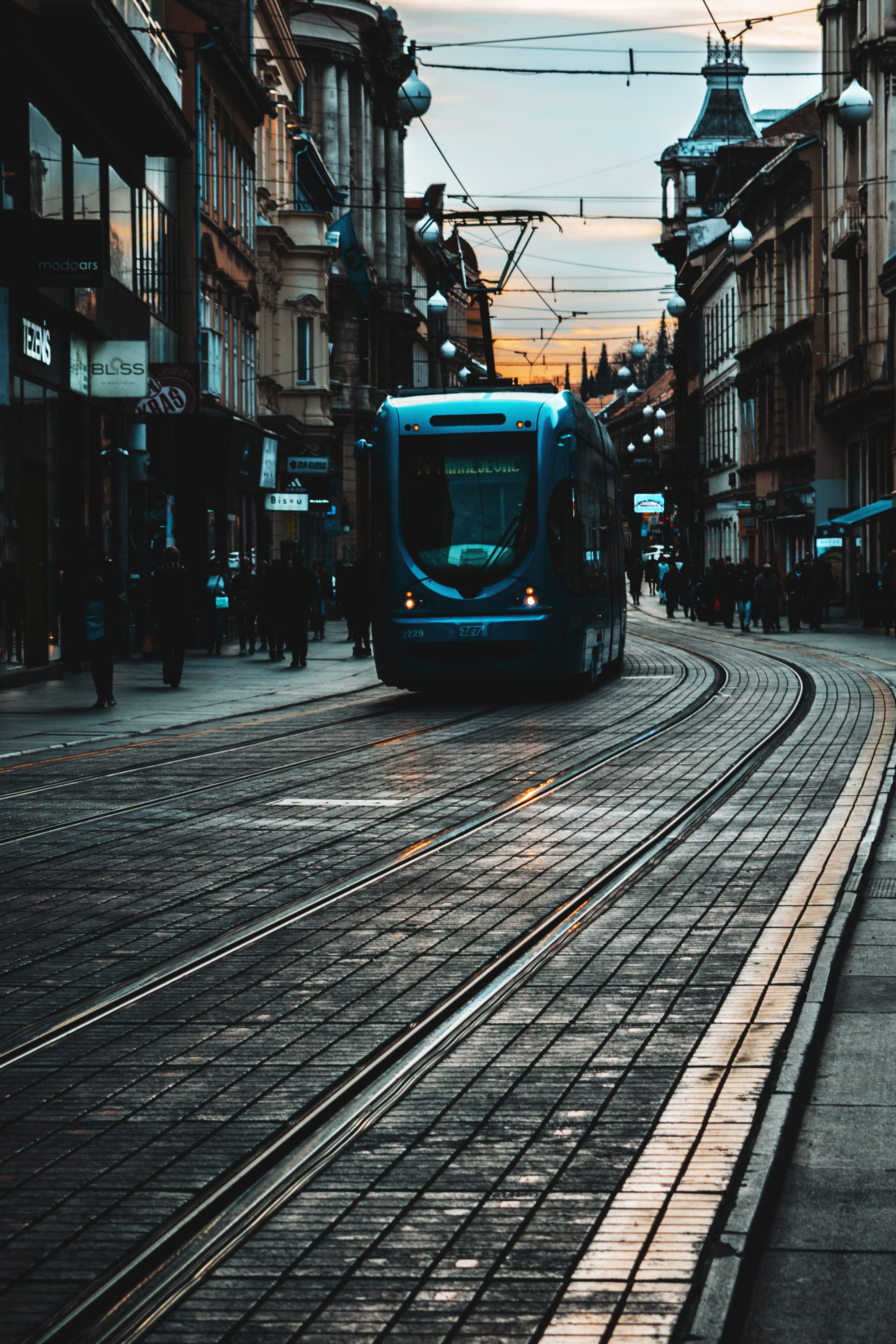 train, cable car, nature, outdoors, path, electricity, bus, public transportation, land vehicle, dark, incidental people, street, trumb, city, track, building exterior, Phone HD Wallpaper