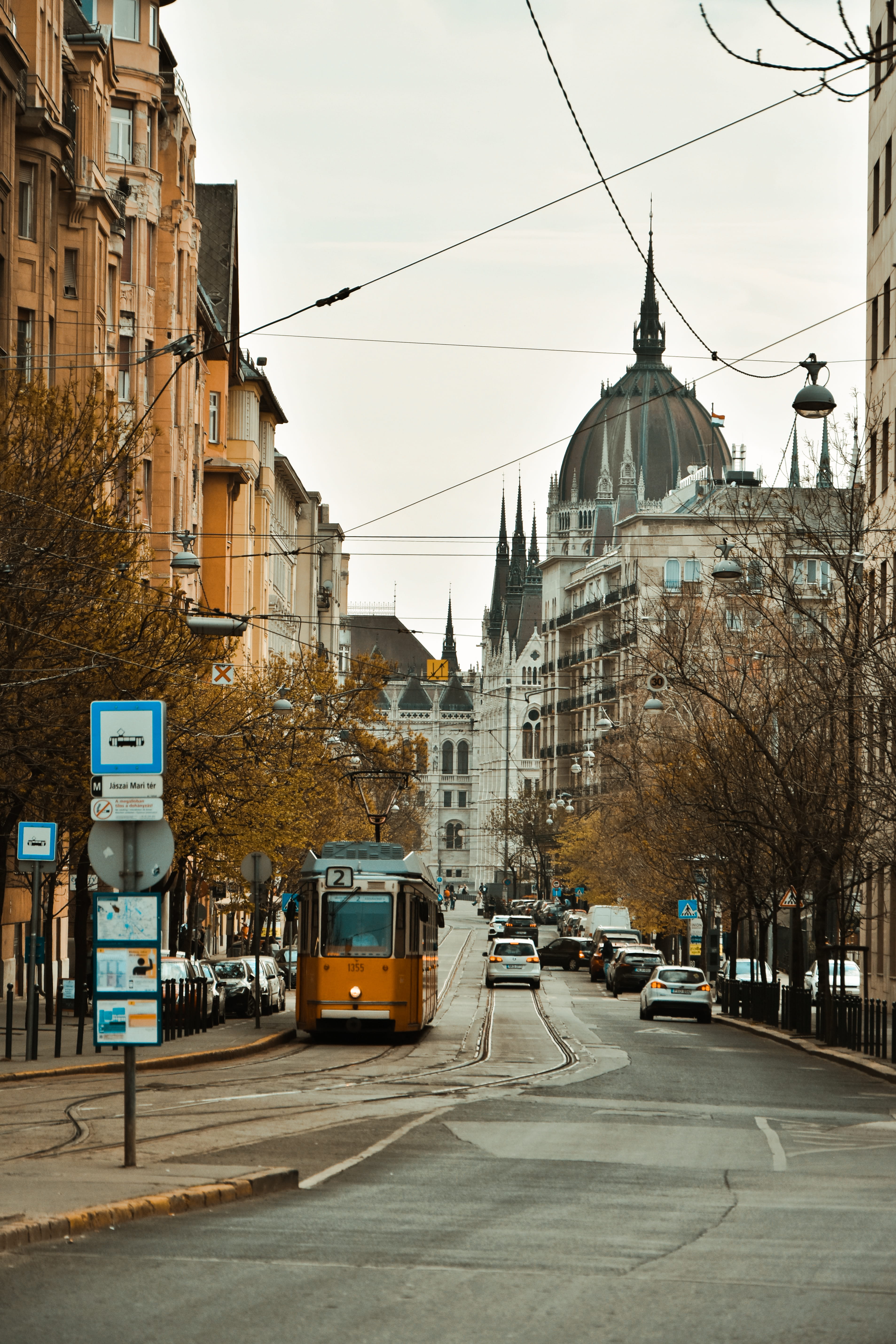 streetcar, city life, metropolis, cable car, tower, building, building exterior, street, steeple, car, sky, vehicle, automobile, built structure, city street, Phone HD Wallpaper