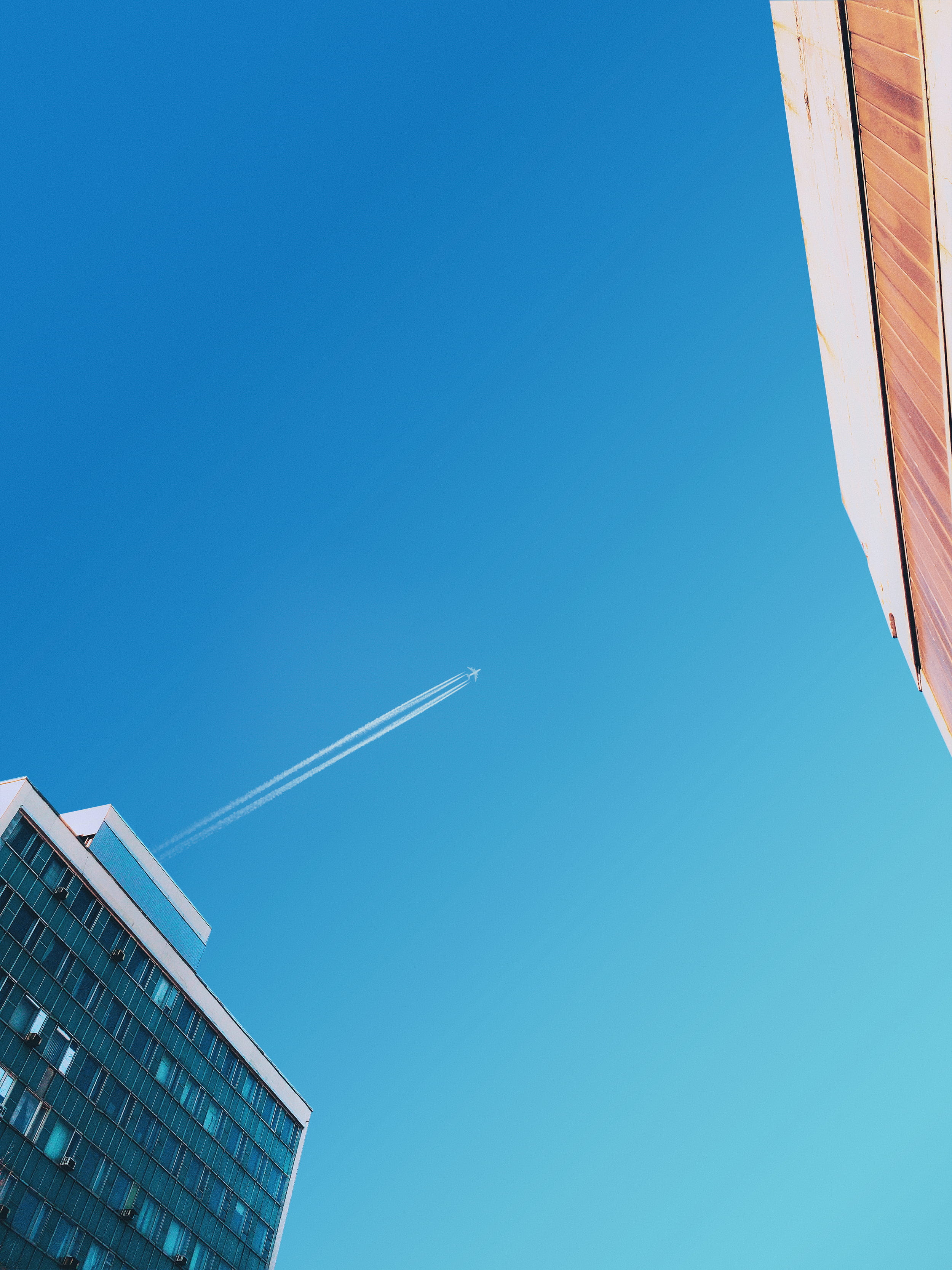 low angle view, office, copy space, skyscraper, nature, city, plane, built structure, tall - high, blue, plane wing, day, architecture, building exterior, Phone HD Wallpaper