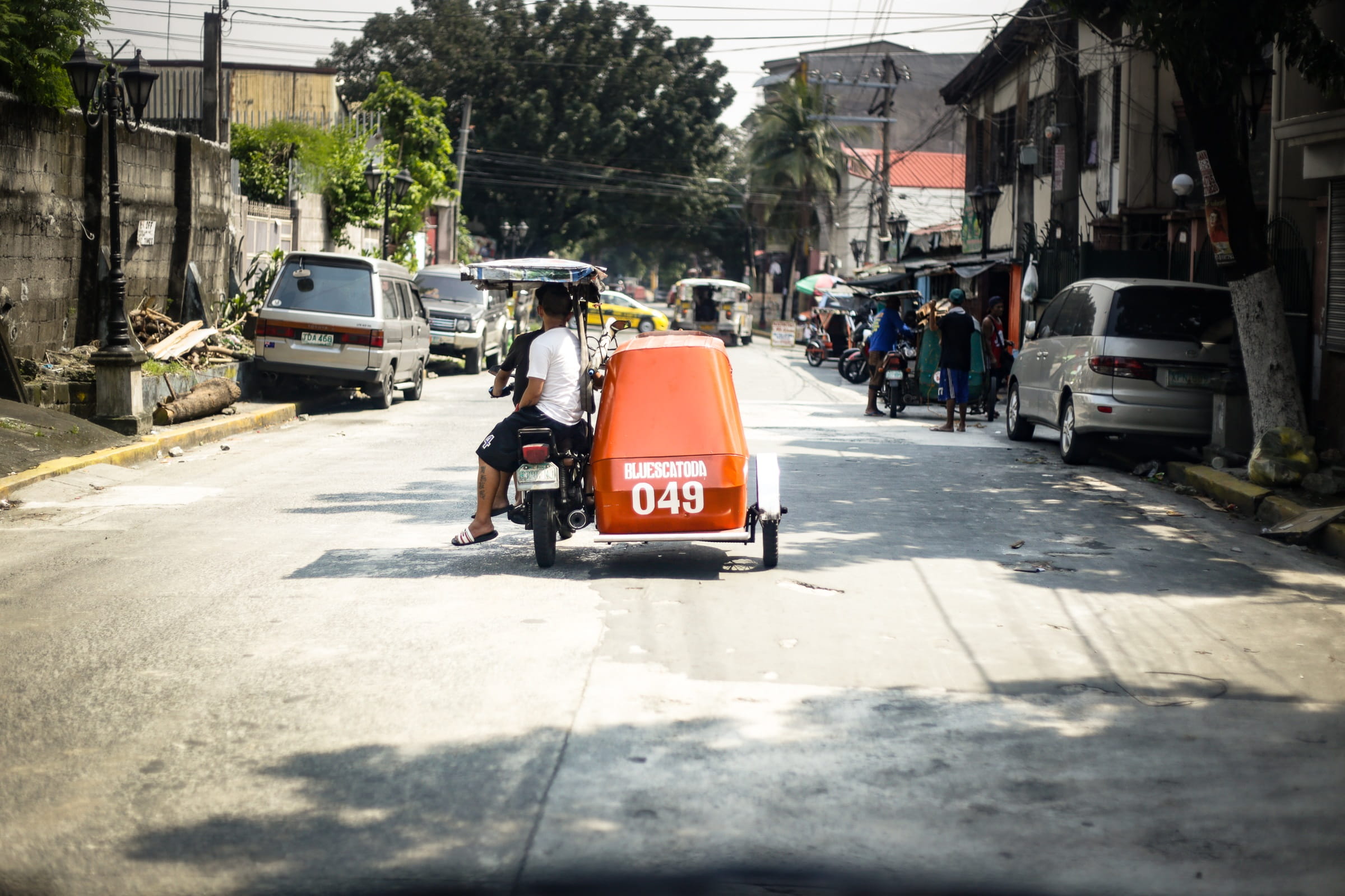 outdoors, motor vehicle, mode of transportation, one person, city street, city, 1080P, mode of transport, road, real people, transporation, vehicle, building exterior, HD Wallpaper