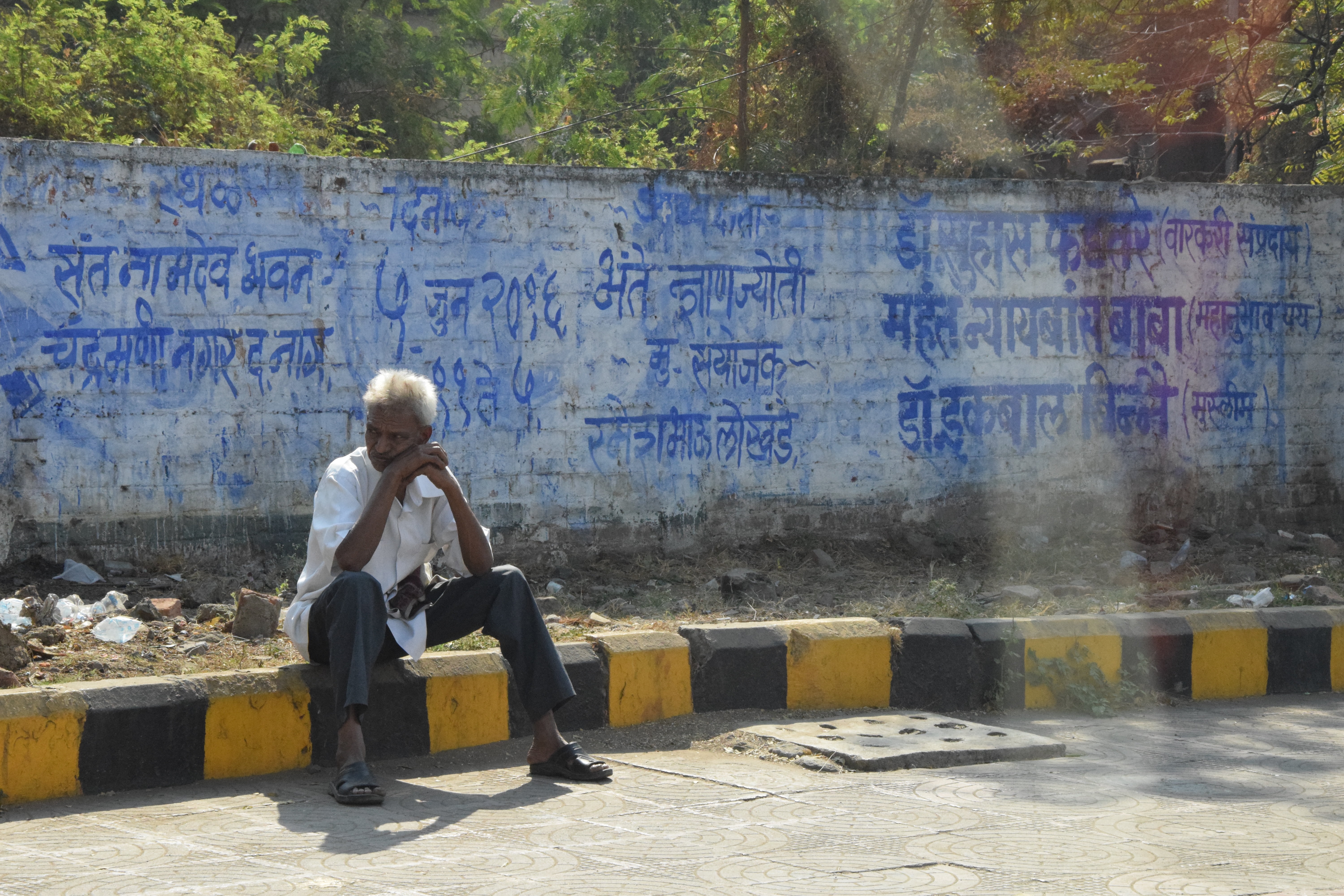 male, seat, graffiti, man, human, sunlight, lifestyles, social issues, sitting, one person, hinduism, real people, 5K, text, relaxation, leisure activity, HD Wallpaper