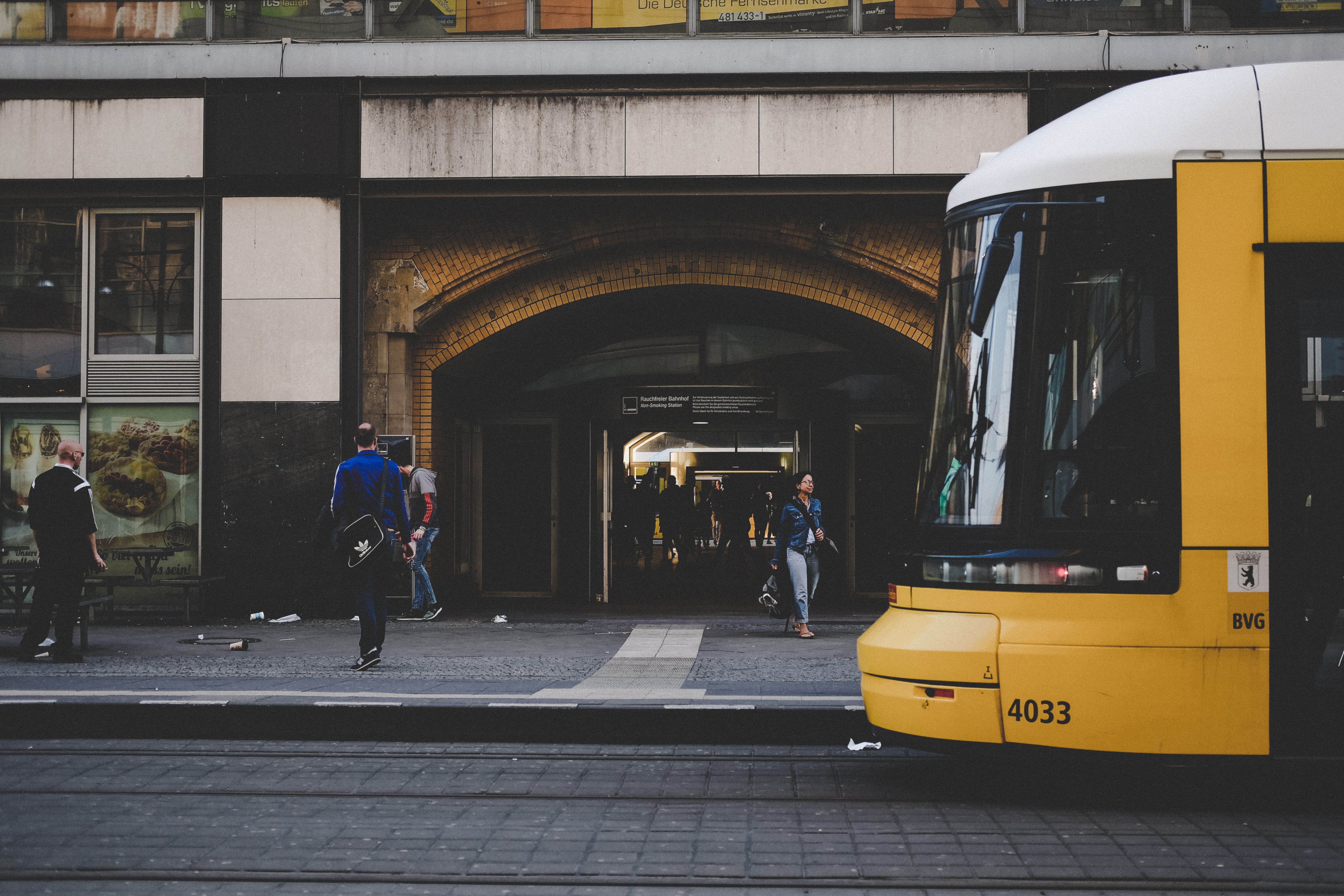 mode of transportation, pavement, yellow, rail transportation, archway, urban, day, transport, adult, men, land vehicle, waiting, building exterior, outdoors, HD Wallpaper