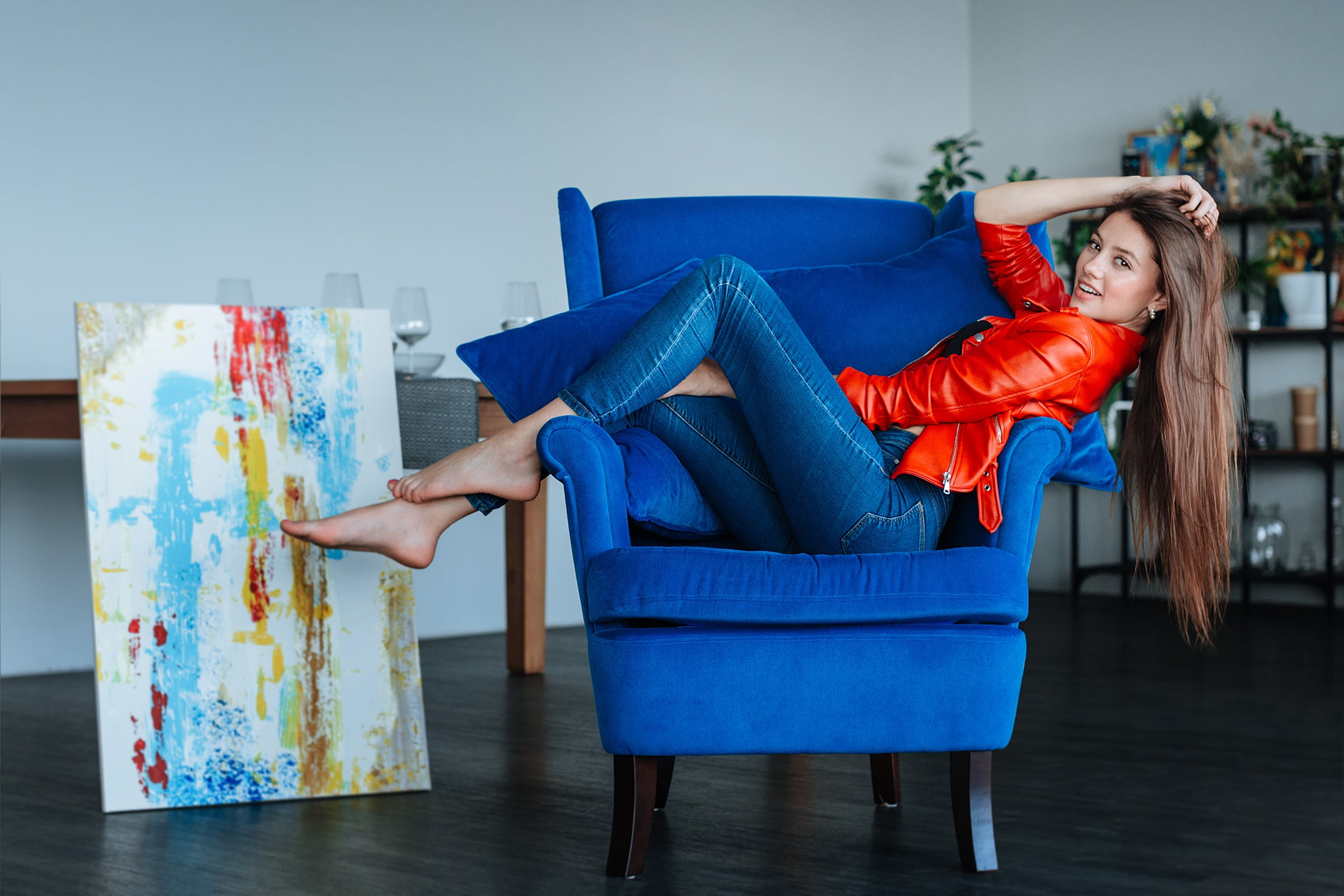 barefoot, blue, brunette, model, women, 1080P, jeans, jacket, women indoors, interior, tiptoe, red jackets, long hair, chair, HD Wallpaper