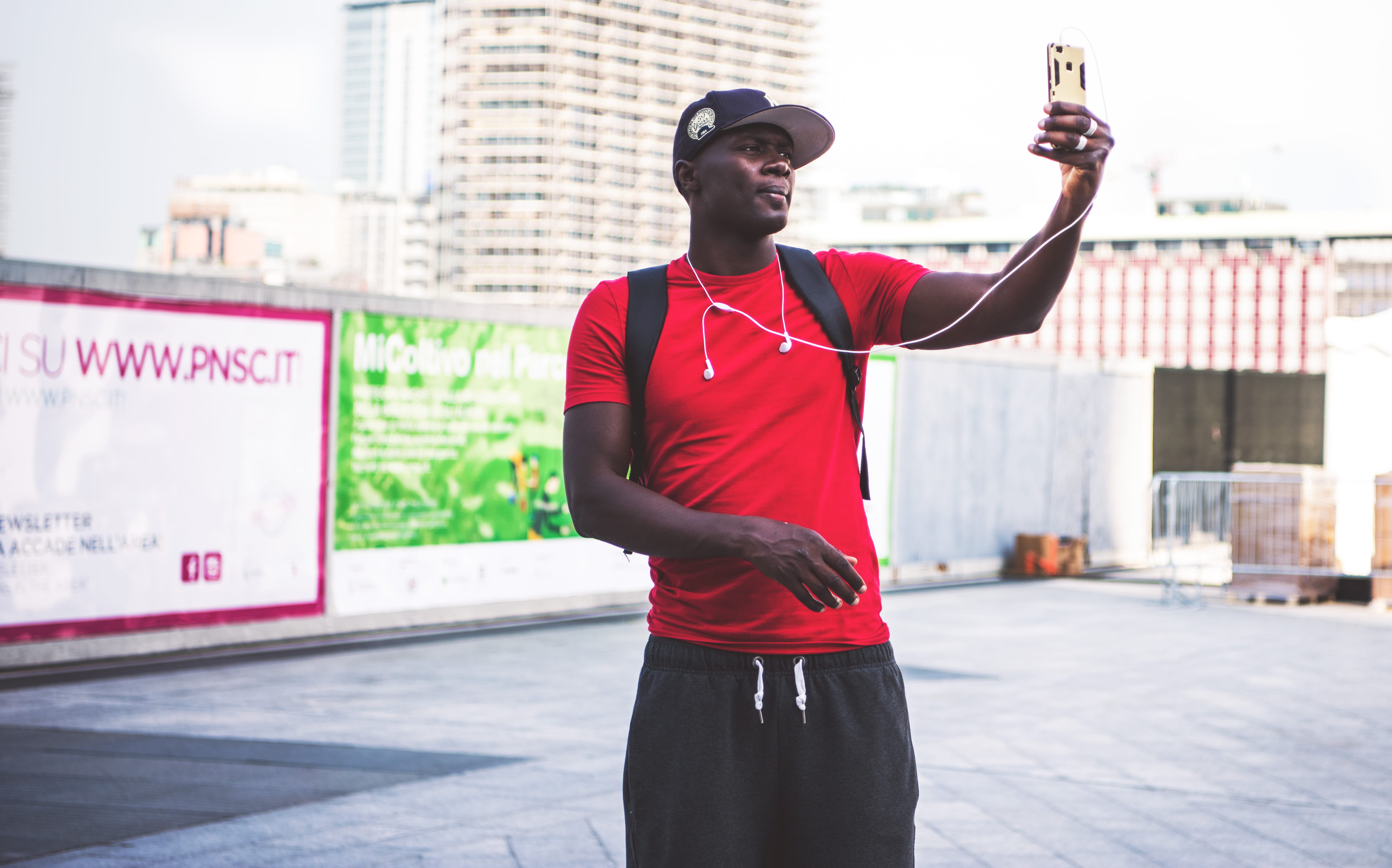 muscle, architecture, red, building exterior, piazza gae aulenti, clothing, young adult, fit, three quarter length, lifestyles, taking, outdoors, arms raised, HD Wallpaper