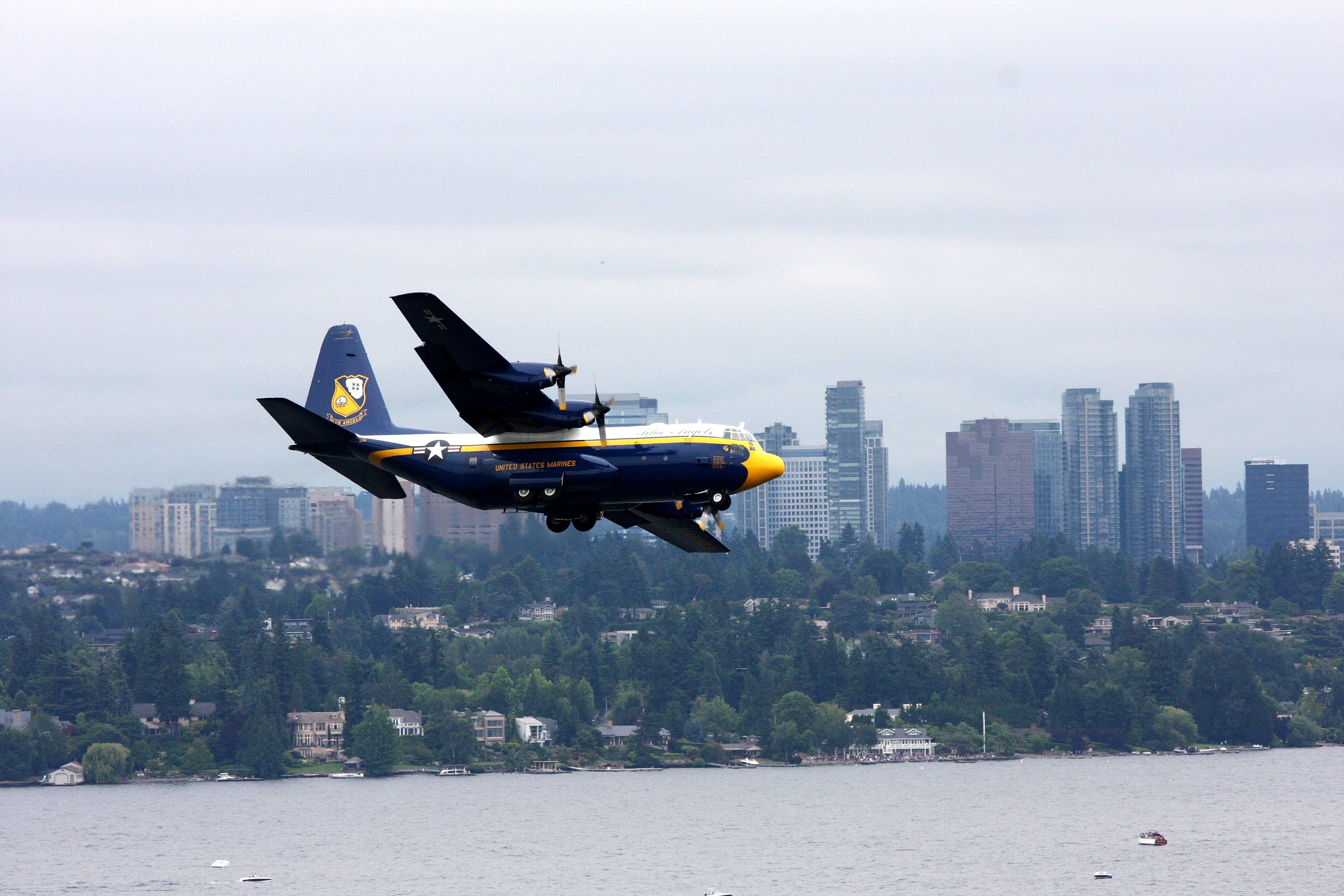 outdoors, Fat Albert, architecture, building exterior, military airplane, aircraft, waterfront, city, sea fair, cargo plane, 4K, transport aircraft, sky, HD Wallpaper