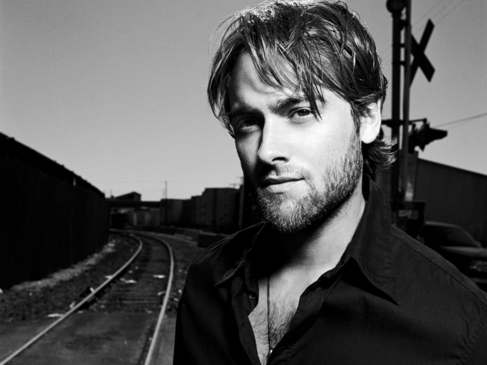 track, young adult, headshot, beard, 720P, leisure activity, looking at camera, shirt, look, contemplation, one person, front view, grayscale, background, HD Wallpaper