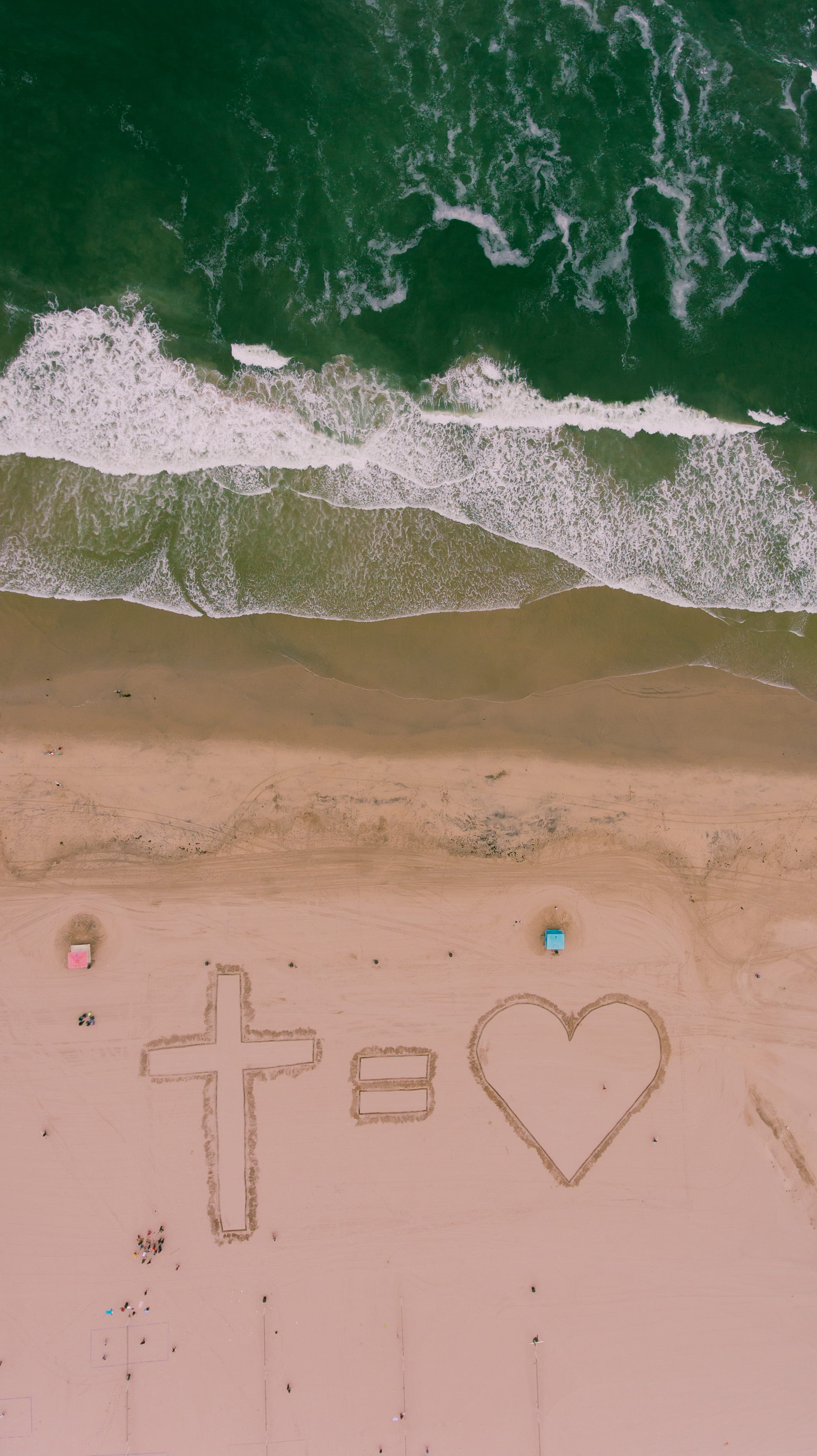 art and craft, aerial view, message, symbol, scenery, wave, sea, beach, 455 pacific coast hwy, cross, day, motion, heart shape, sea waves, huntington beach, Phone HD Wallpaper