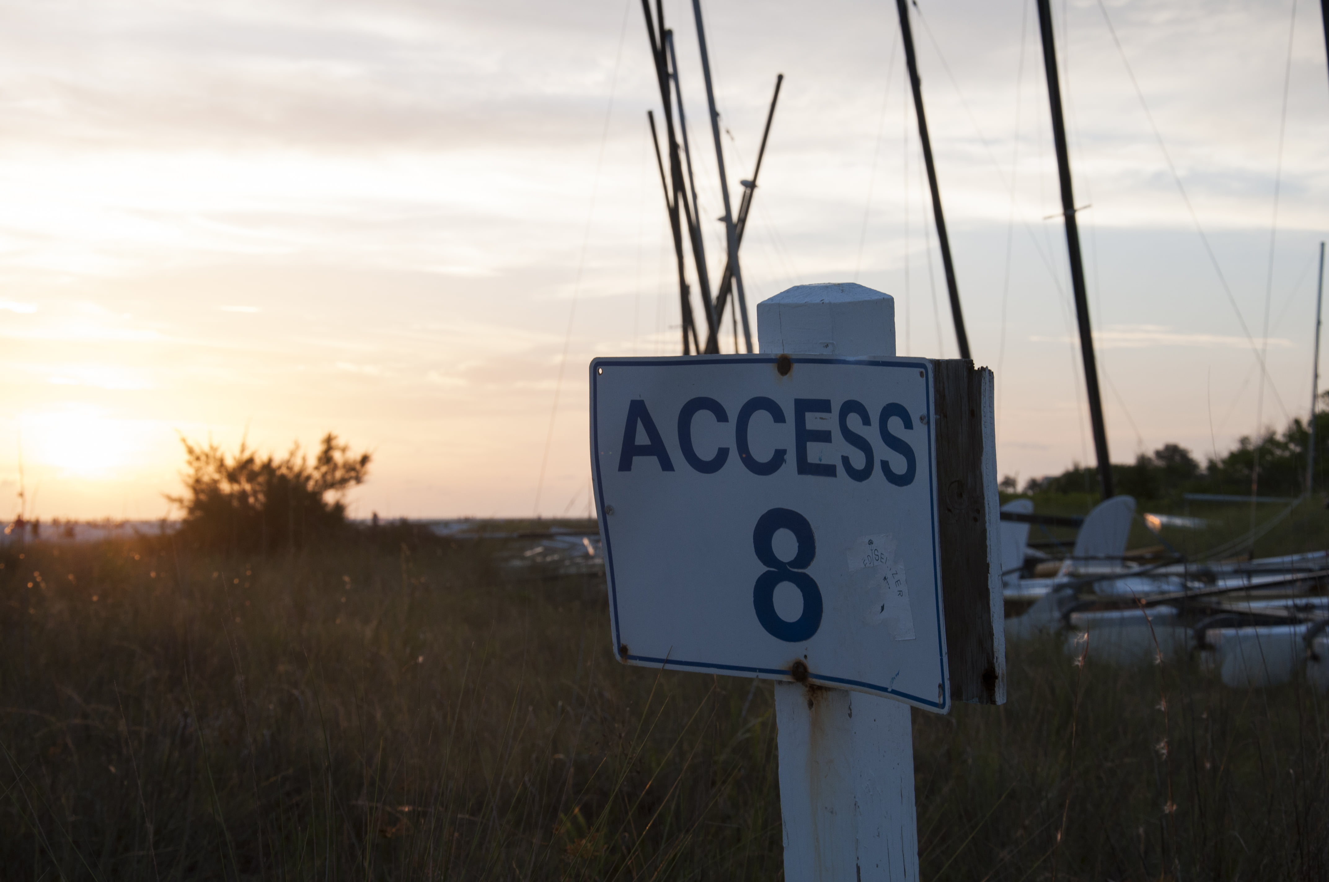 text, no people, sunset, plant, nature, communication, pole, 4K, land, grass, focus on foreground, information, field, guidance, cloud - sky, Florida, HD Wallpaper