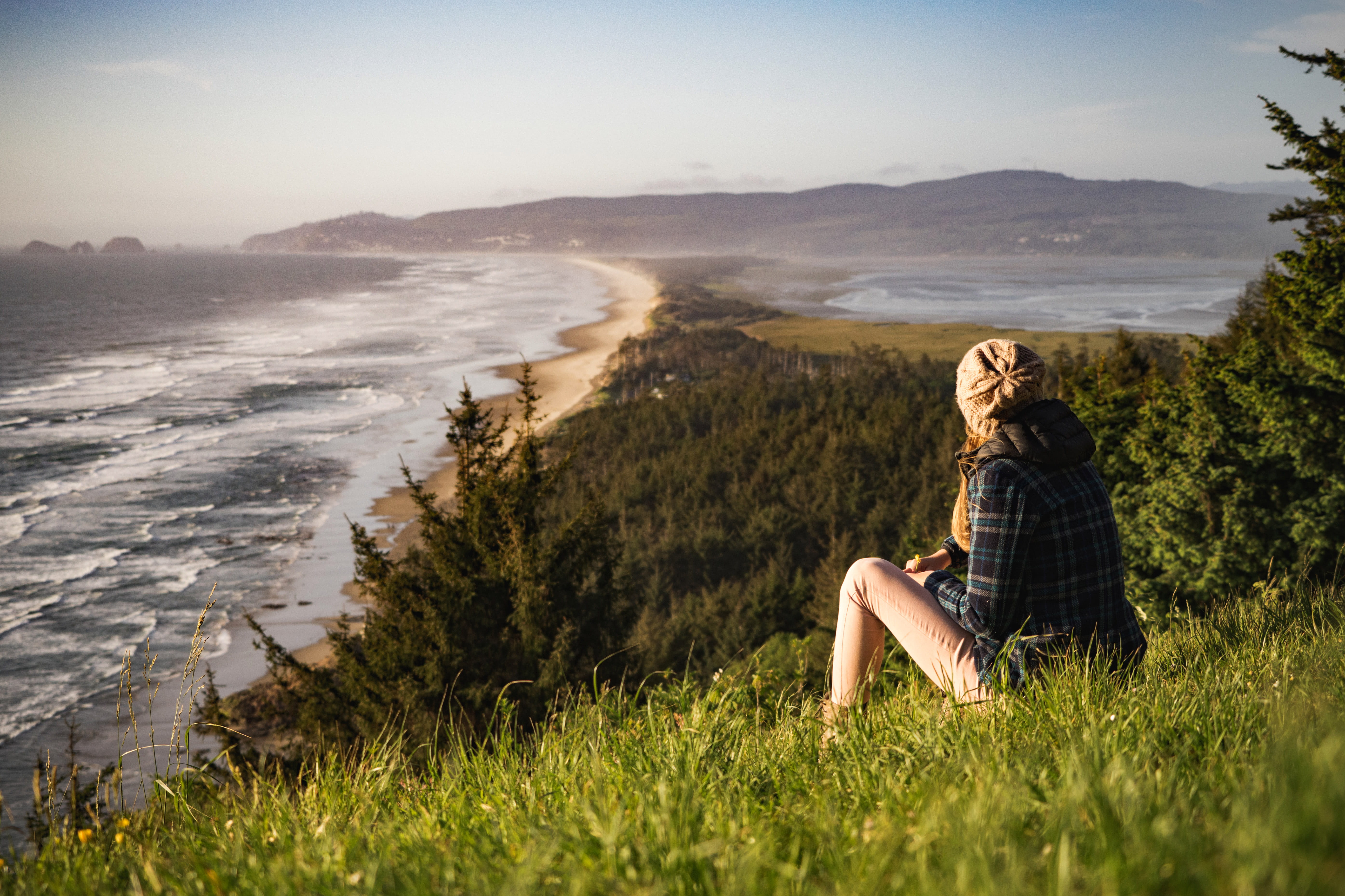 blond hair, looking at view, sitting, people, vacations, shoreline, outdoors, public domain, Girl, grass, women, looking, hairstyle, summer, day, scenic, HD Wallpaper