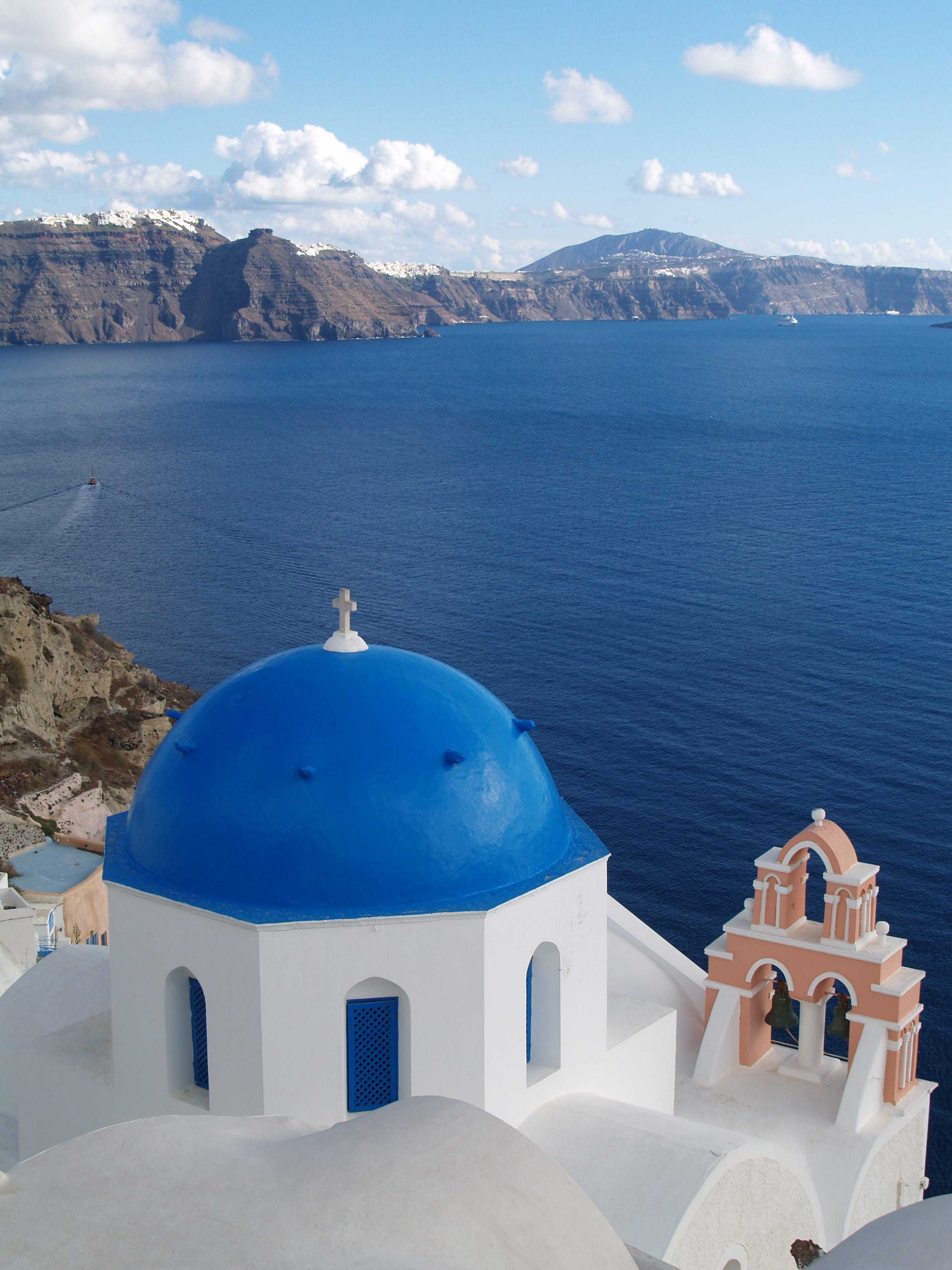 Greece, 2K, sea, no people, sky, spirituality, scenics - nature, built structure, mountain, building, place of worship, belief, water, whitewashed, day, Phone HD Wallpaper