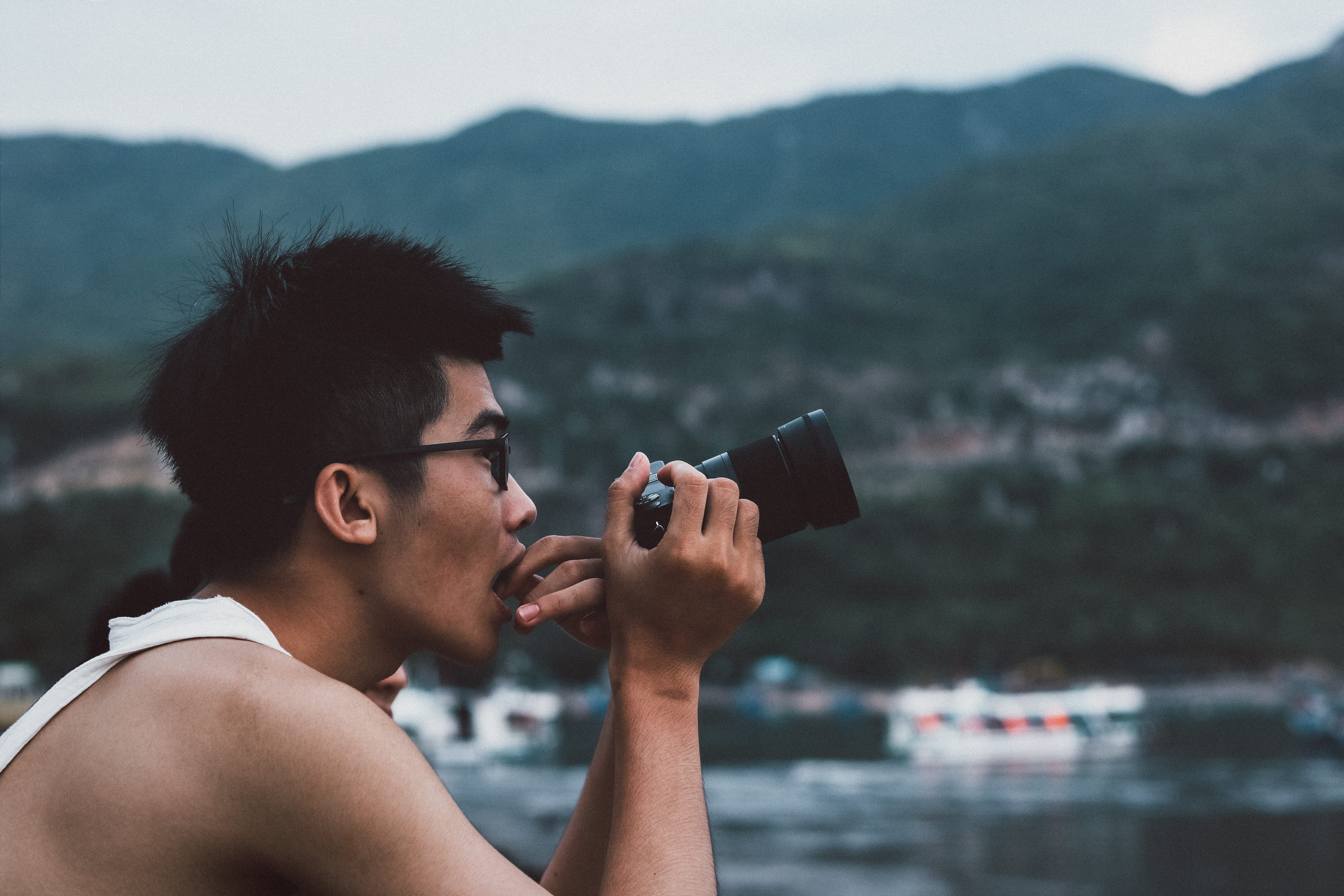 photographic equipment, human, black hair, outdoors, tourist, technology, holding, person, photographer, activity, taking, wireless technology, leisure activity, HD Wallpaper