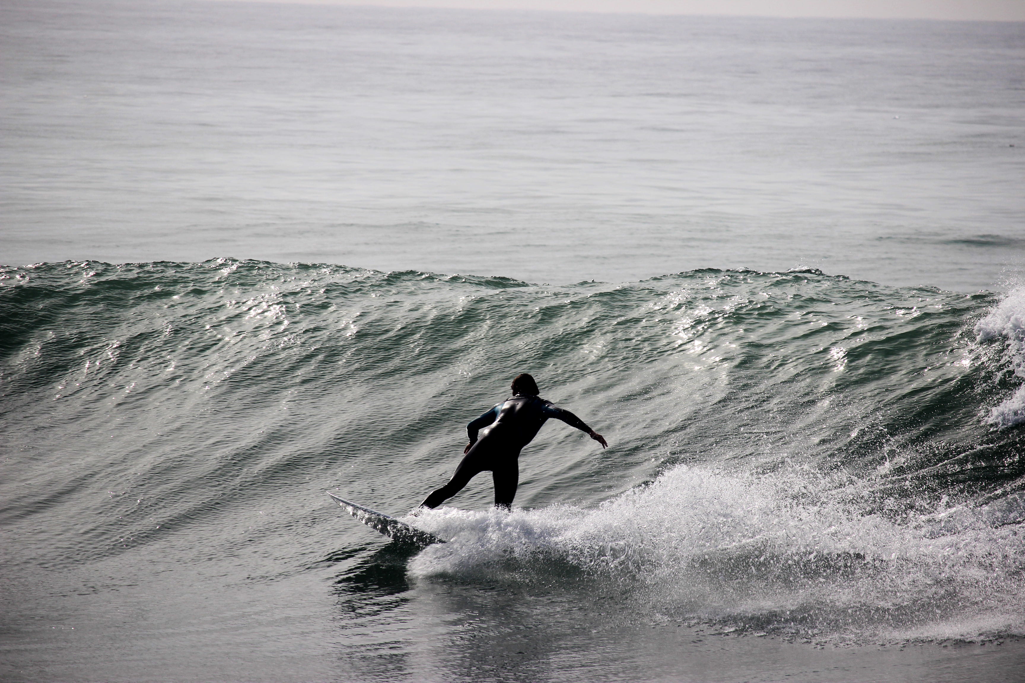 silhouette, surfer, one person, day, horizon over water, motion, black and white, photography, wafe, ocean, surfing, skill, real people, surfboard, person, HD Wallpaper
