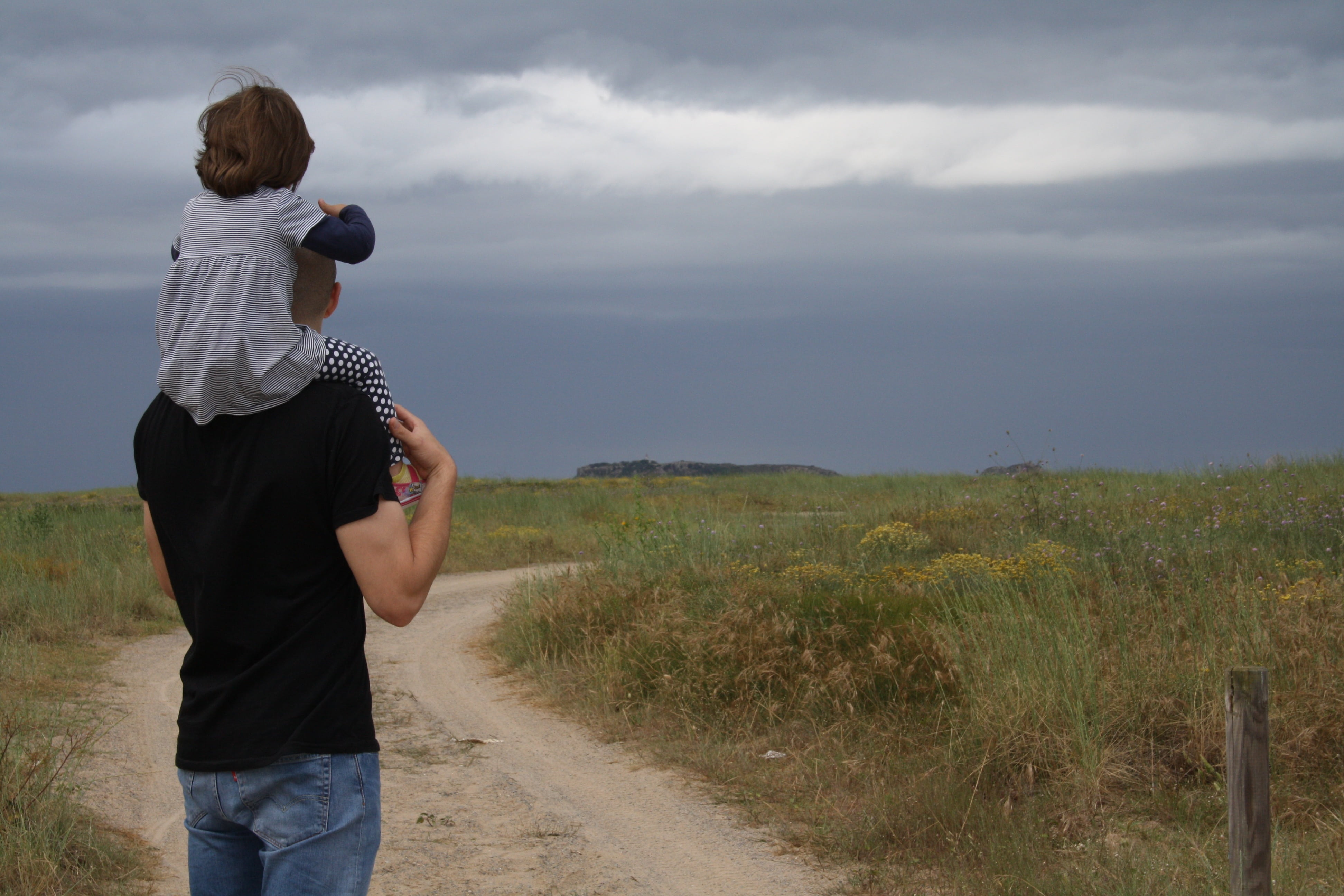 non-urban scene, rain, blue, holiday, father daughter, males, leisure activity, land, three quarter length, cloud, jeans, grass, scenics - nature, carrying, HD Wallpaper