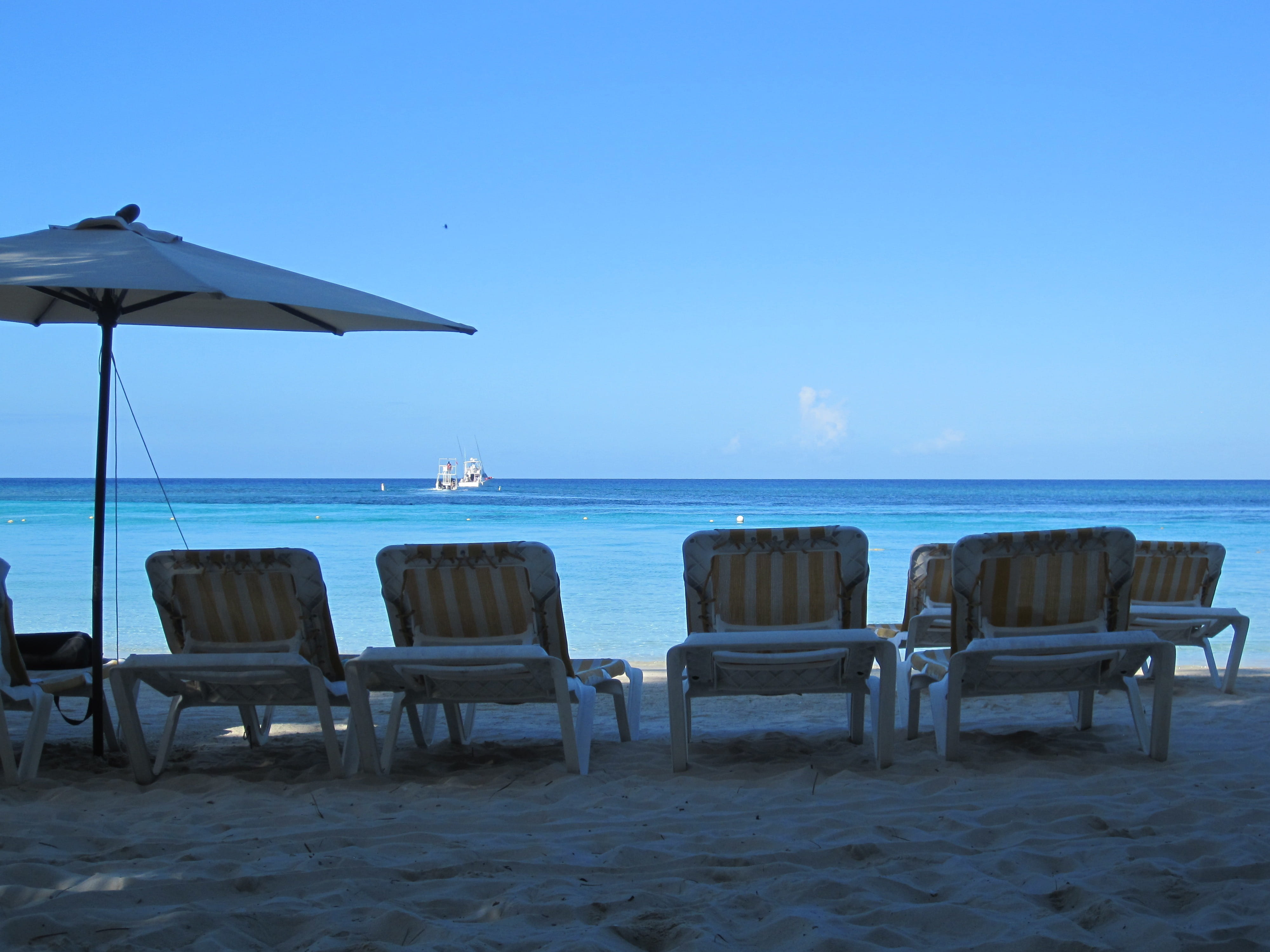 Sunloungers, no people, blue, Sea, chair, luxury, sky, clear sky, absence, seat, outdoors, chairs, sand, table, tranquil scene, land, water, beauty in nature, HD Wallpaper