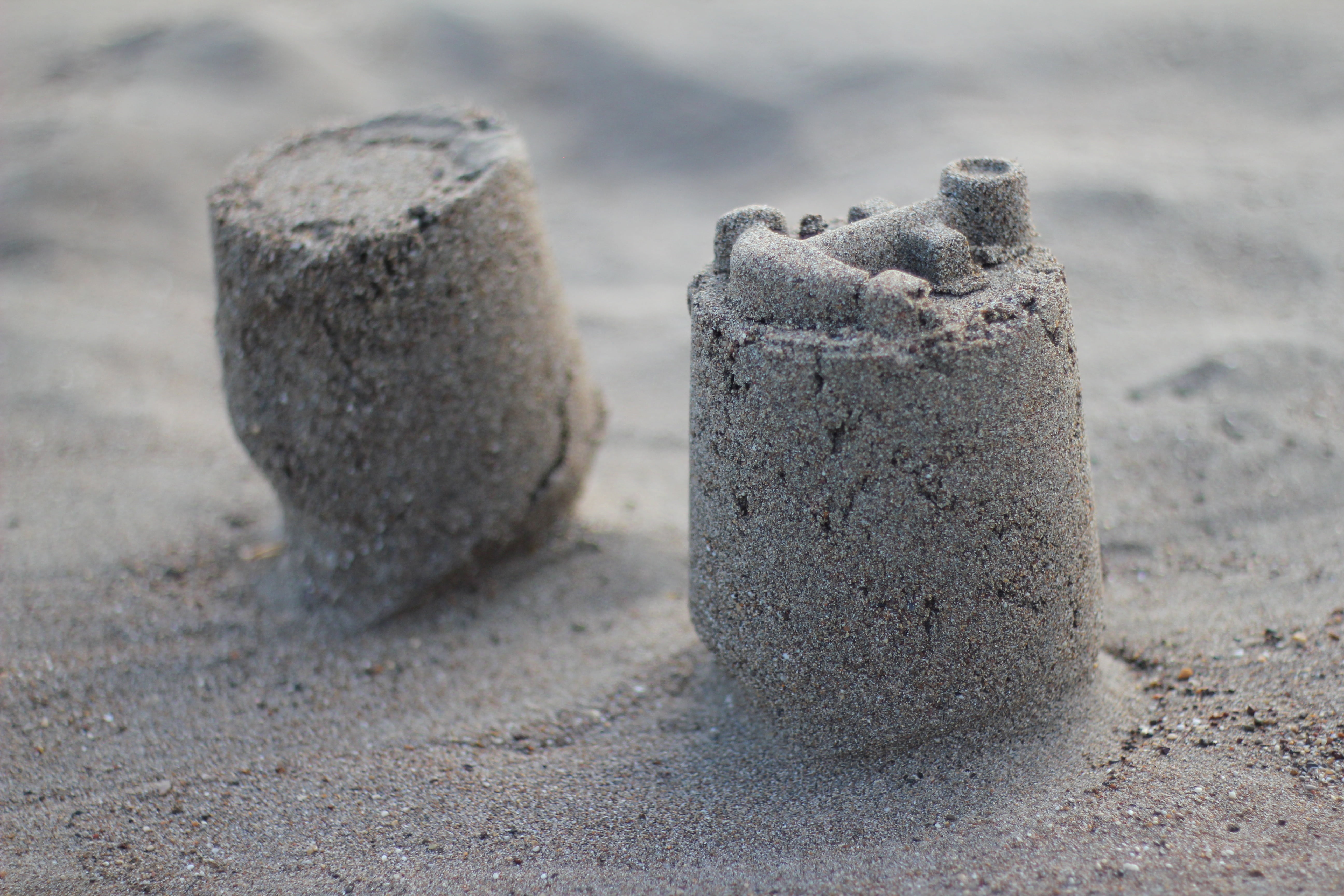 two objects, castle, sun, environment, rock, holiday, rock - object, day, childhood, sea, fun, nature, beach, land, sand, selective focus, ocean, close-up, HD Wallpaper