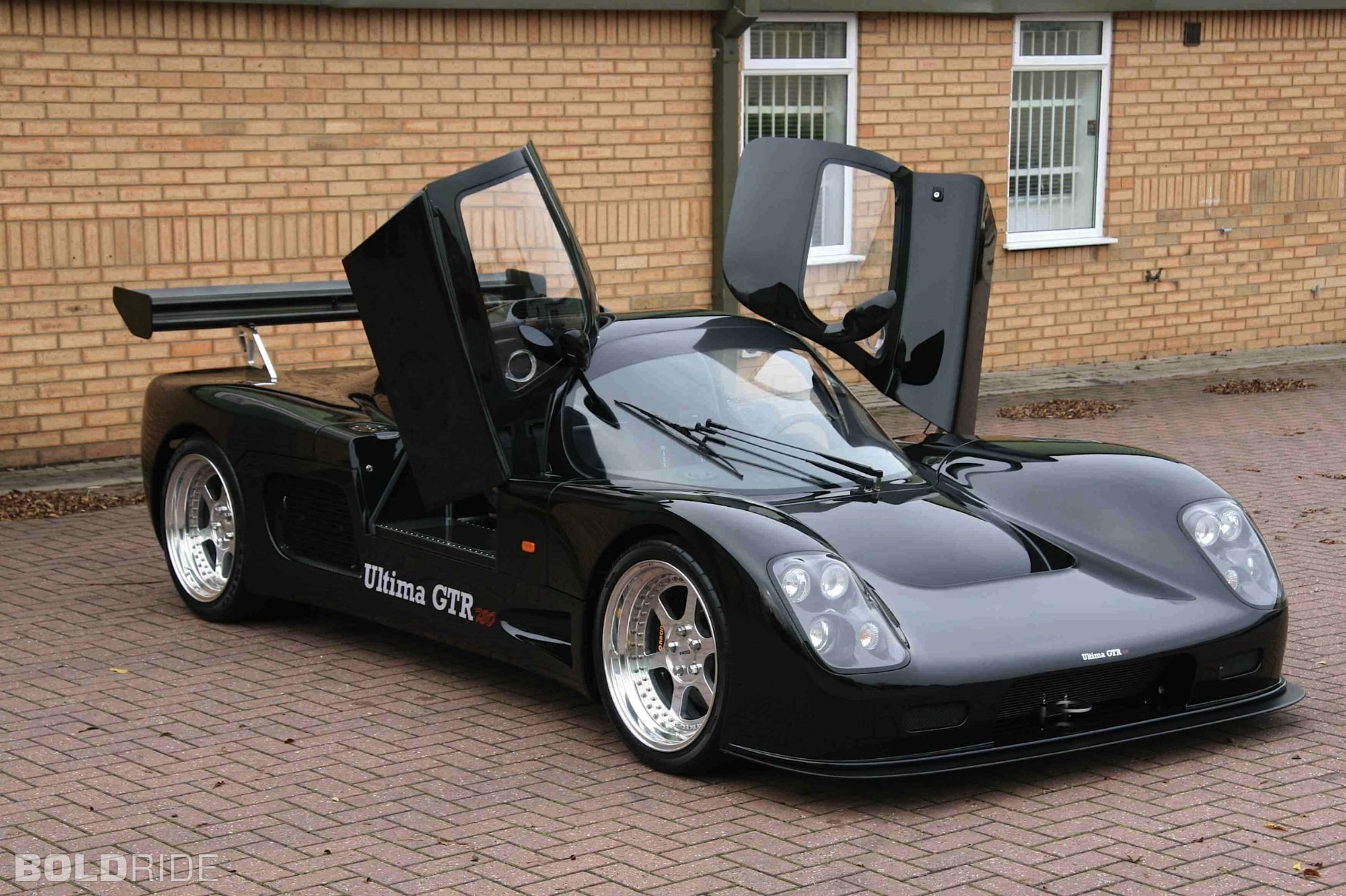 car, built structure, brick wall, motor vehicle, transportation, 2007, day, black color, supercars, 1080P, architecture, no people, cobblestone, mode of transportation, HD Wallpaper