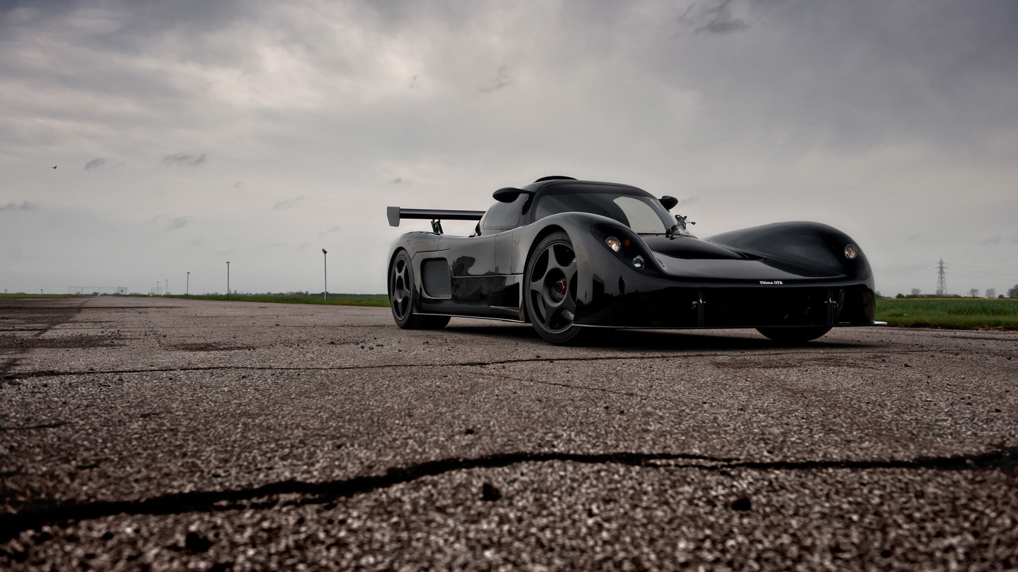 overcast, driving, 1080P, speed, storm, racecar, surface level, city, land vehicle, sky, nature, car, street, motor vehicle, cloud - sky, ultima, transportation, HD Wallpaper