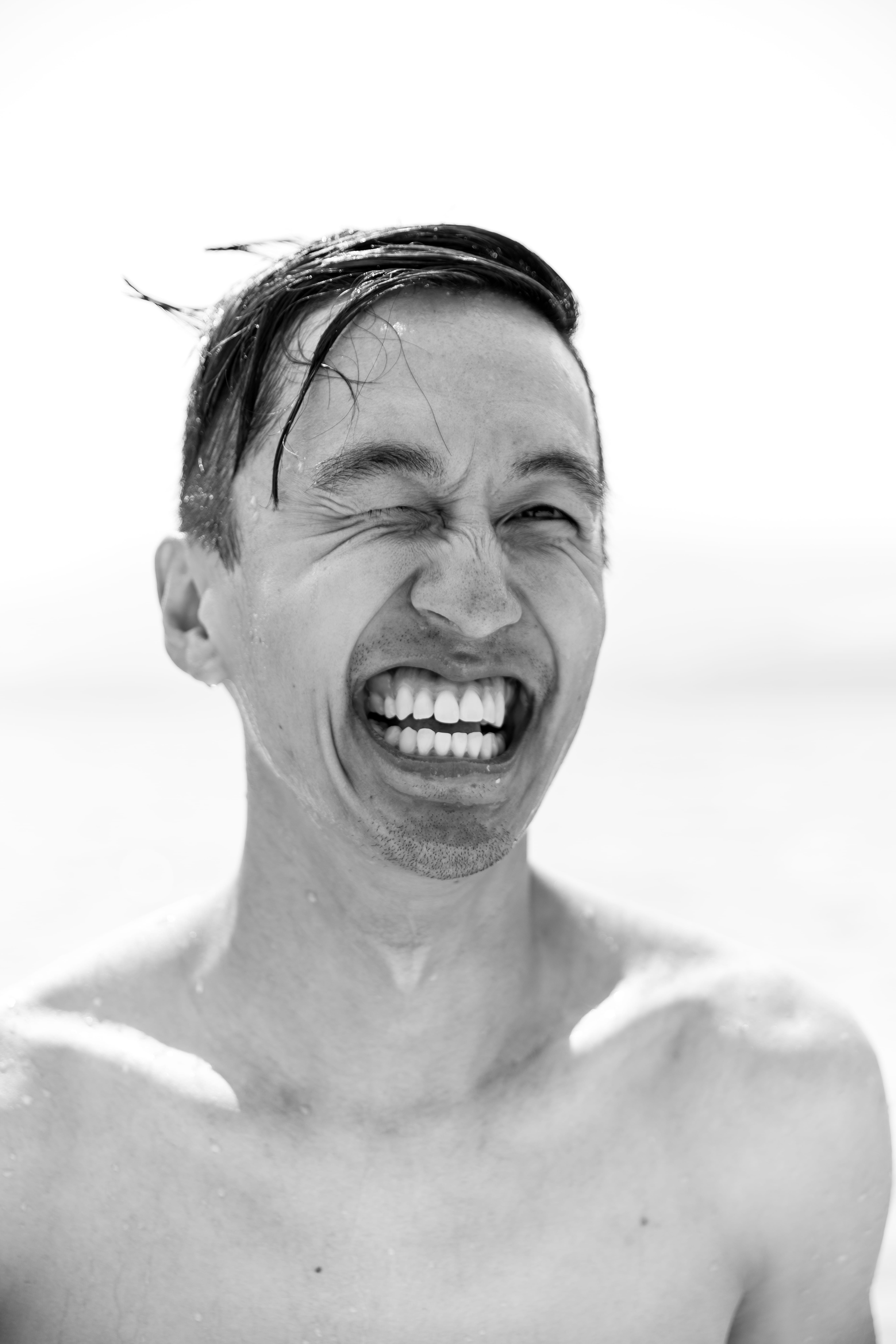 headshot, real people, smile, one person, adventure, male, shirtless, land, wet, boy, looking at camera, front view, nature, black and white, photography, Phone HD Wallpaper