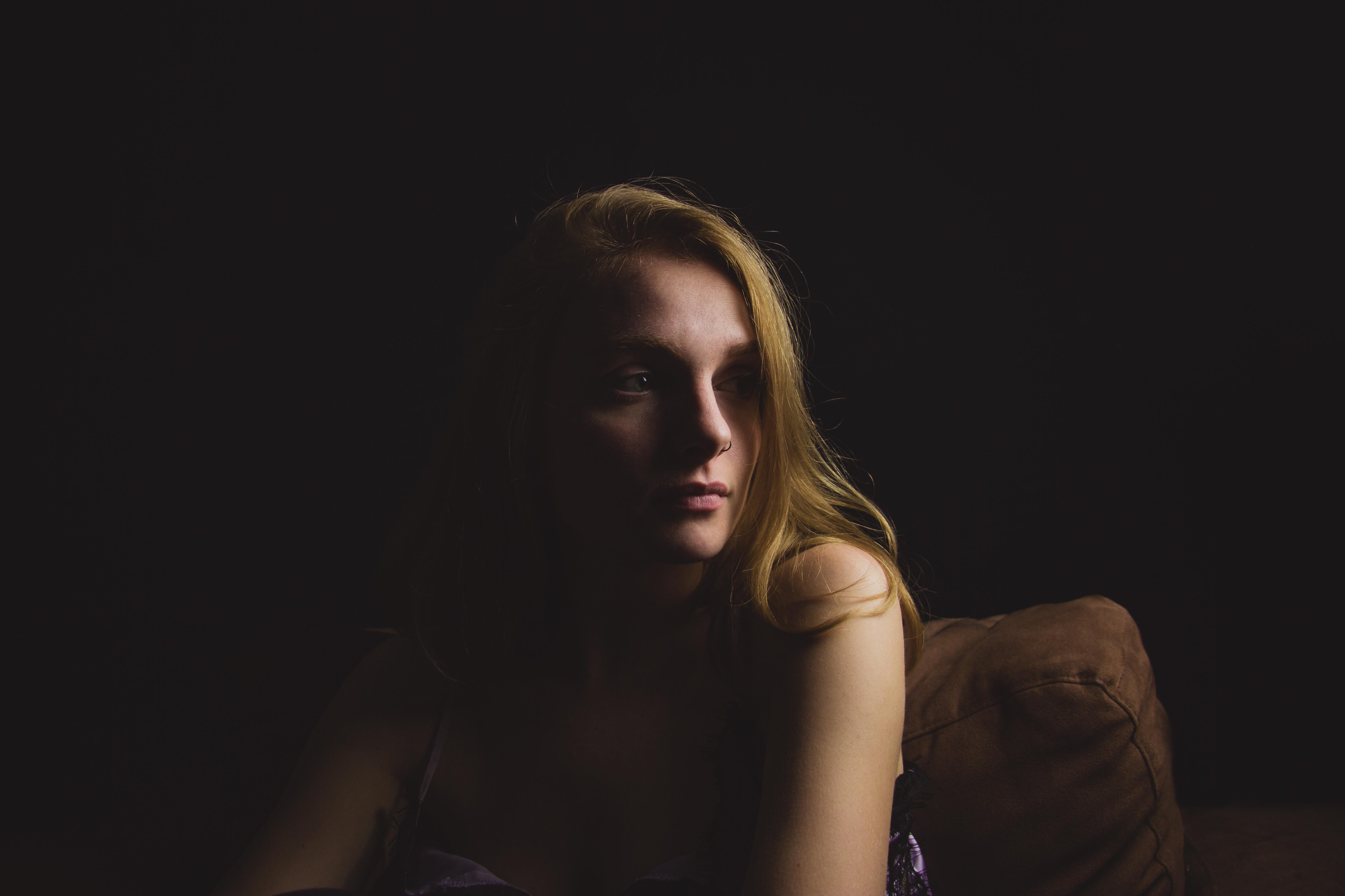 suede, beautiful woman, woman, s, hairstyle, headshot, sitting, copy space, emotion, portrait, contemplation, gray, portait, women, black background, adult, HD Wallpaper