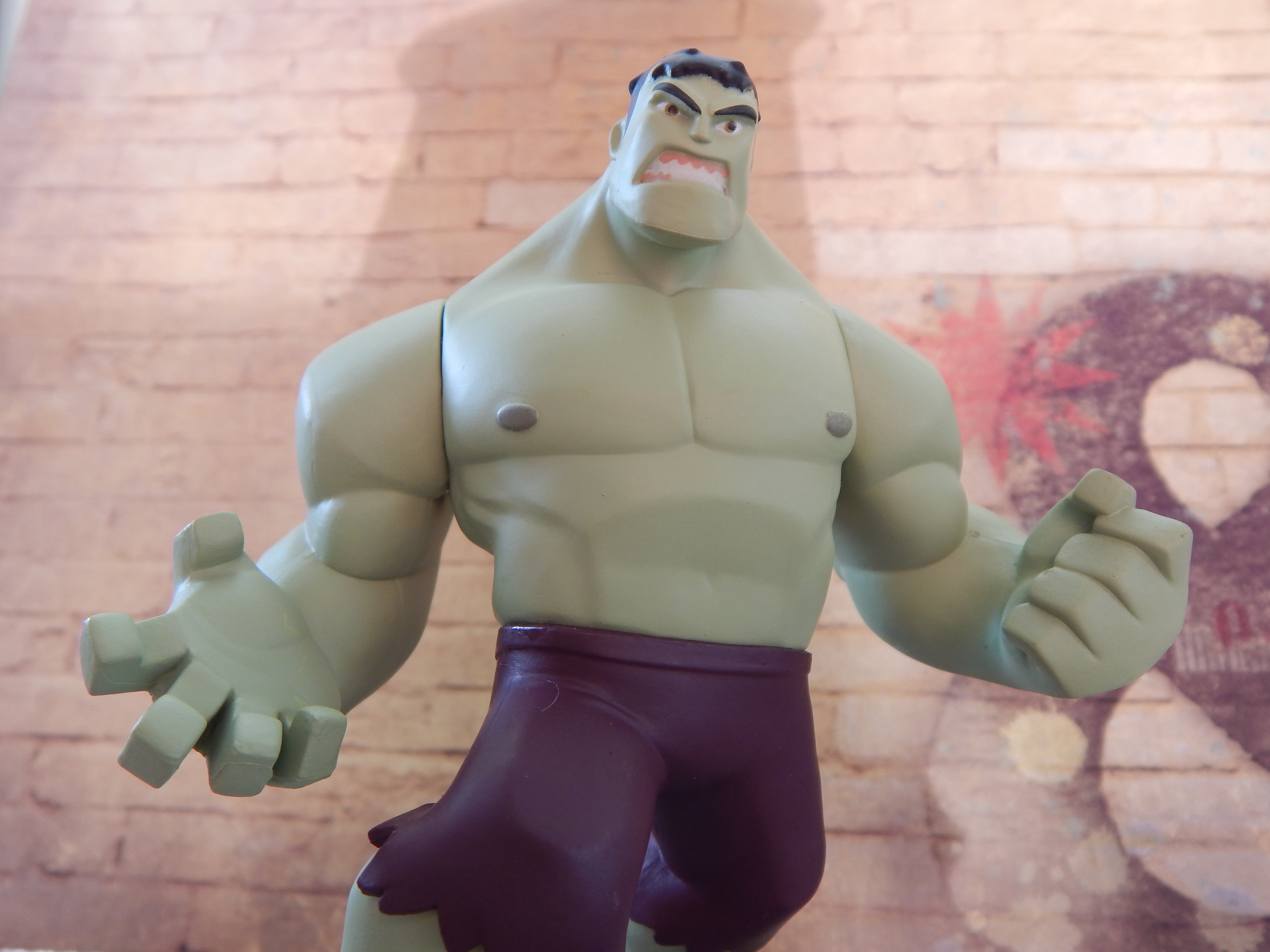 brick wall, character, power, hero, sculpture, man, huge, representation, person, holding, figurine, wall - building feature, figure, male likeness, front view, HD Wallpaper