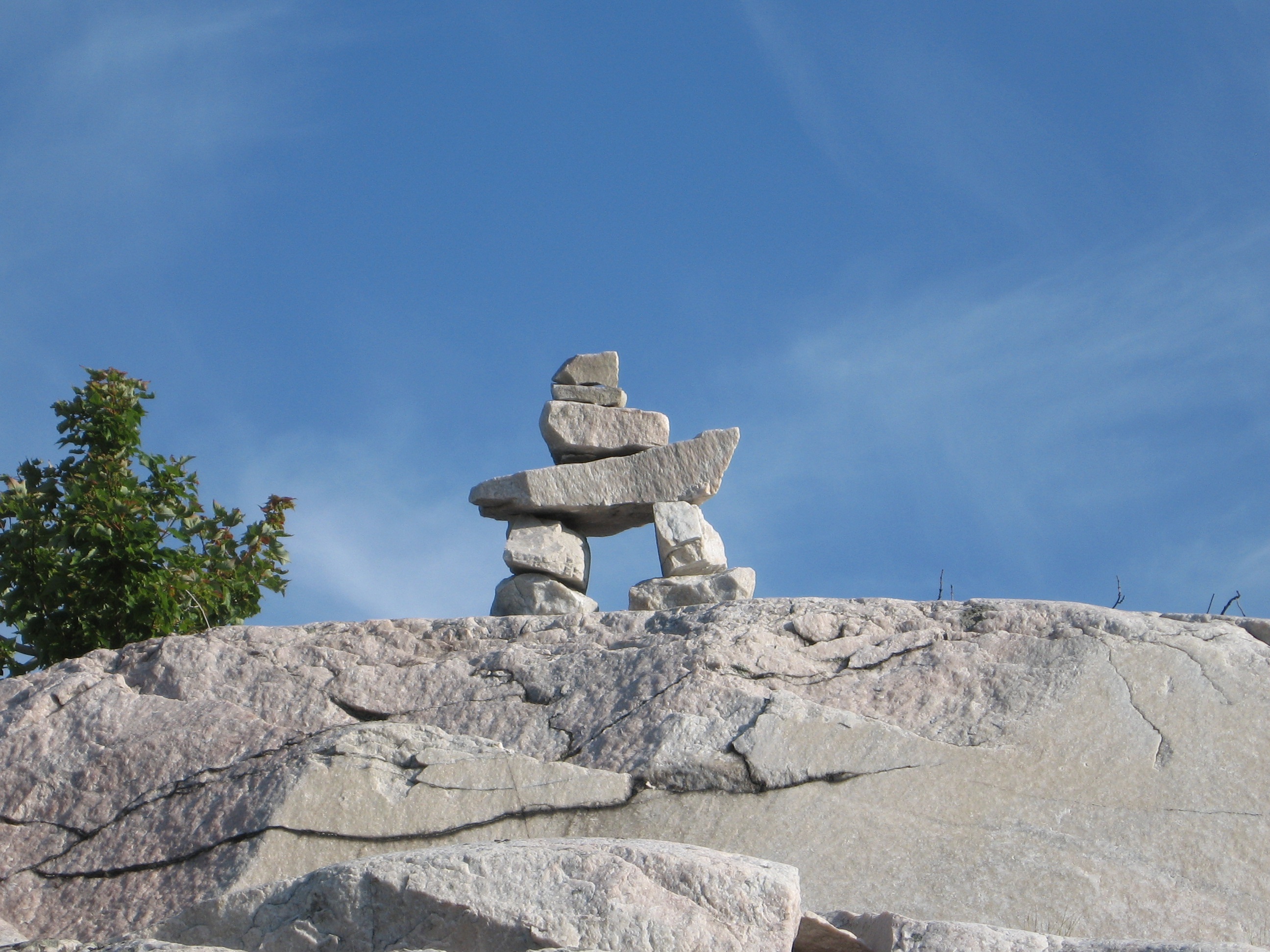 figure, inuit, day, religion, sculpture, mountain, rock - object, kilarney, low angle view, 2K, architecture, clear sky, blue, tranquility, built structure, HD Wallpaper