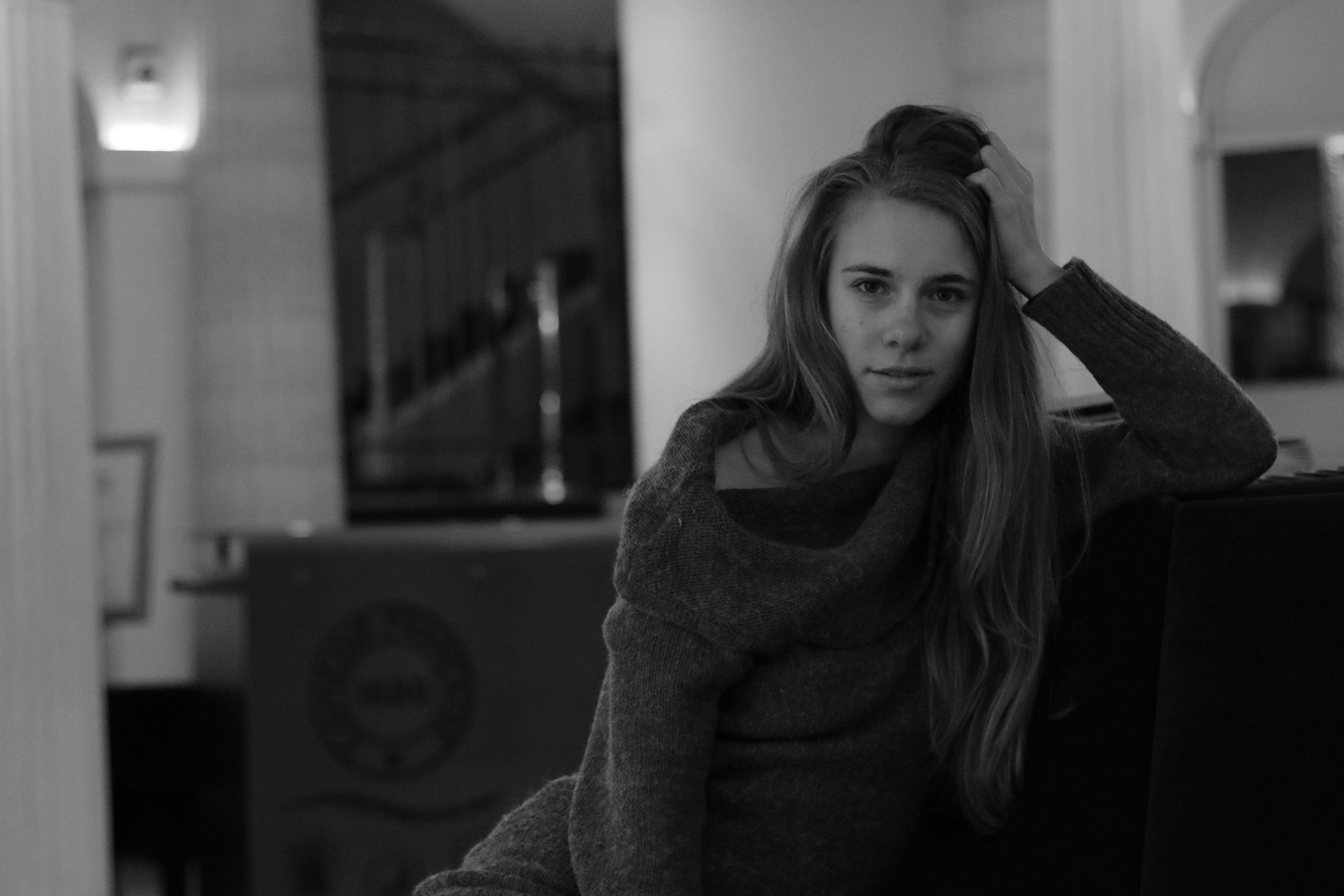 young adult, female, beauty, contemplation, leaning, model, beautiful woman, lifestyles, beautiful, 5K, clothing, sitting, indoors, grayscale, looking at camera, HD Wallpaper