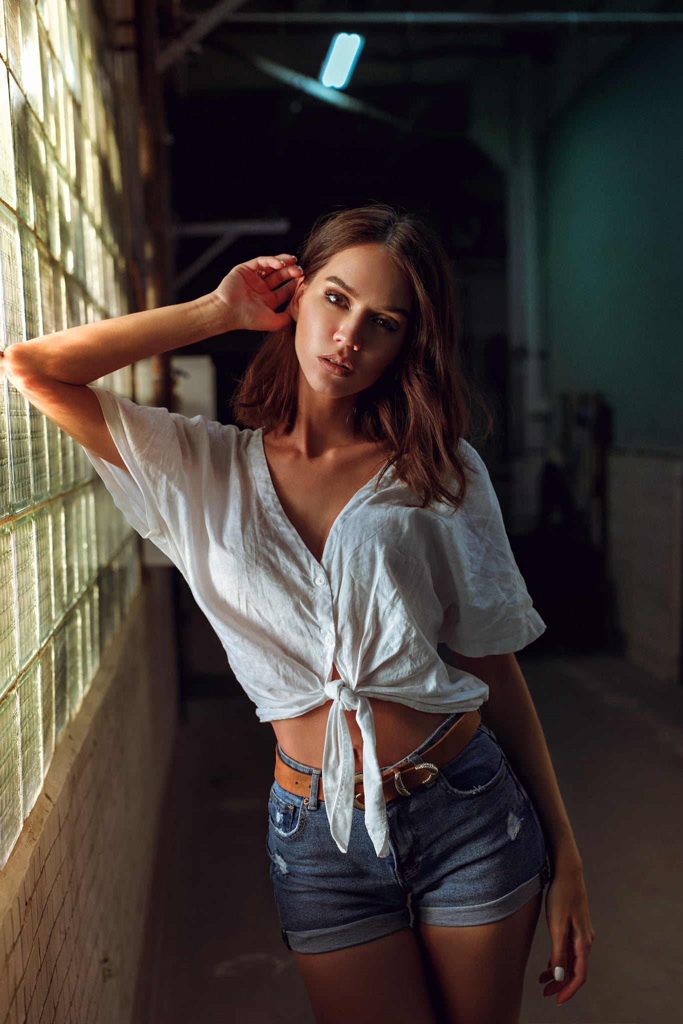 shorts, long hair, white clothing, knot, makeup, jeans, window, shirt, Kirill Averyanov, 1080P, brunette, women, looking at viewer, denim, Phone HD Wallpaper