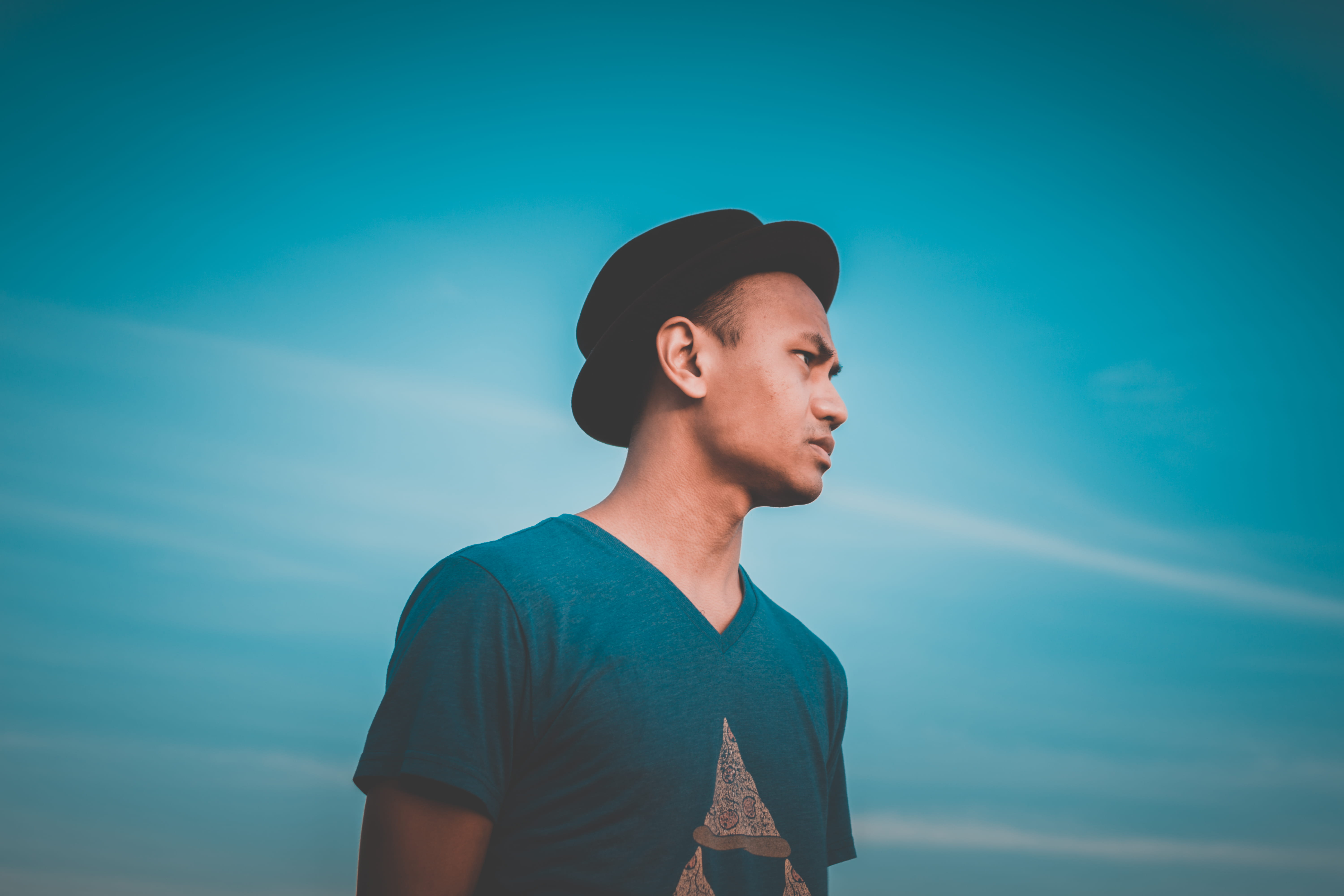 daytime, hat, young men, cap, day, portrait, lifestyles, men, leisure activity, young adult, man, shirt, looking away, sideways, outdoors, green, clothing, HD Wallpaper