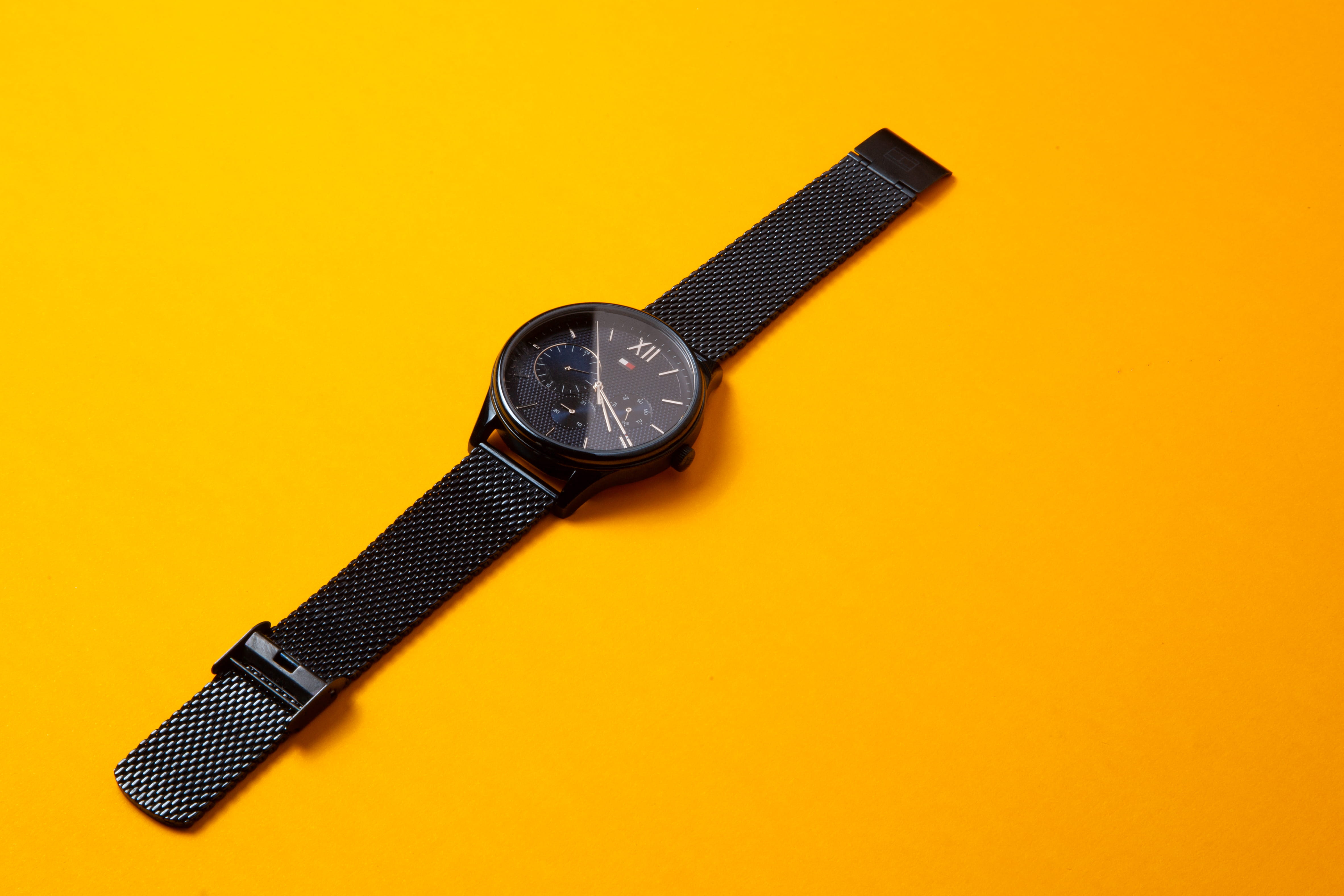 no people, technology, work tool, high angle view, single object, Watch, silver colored, still life, metal, personal accessory, orange background, black color, HD Wallpaper