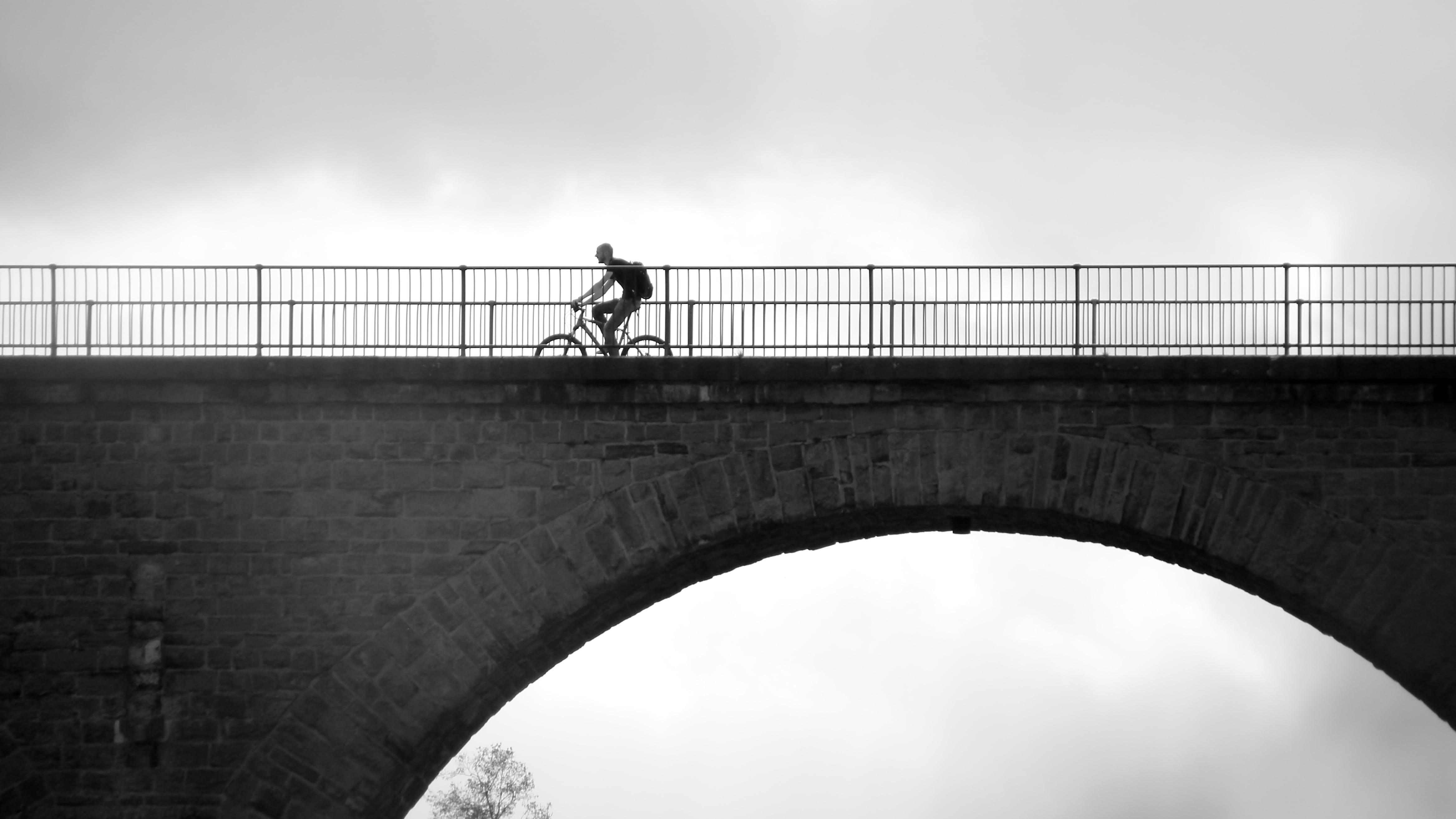 one person, railing, city, cyclists, more, transportation, bridge, men, bridge - man made structure, built structure, outdoors, bicycle, tour, bike ride, HD Wallpaper