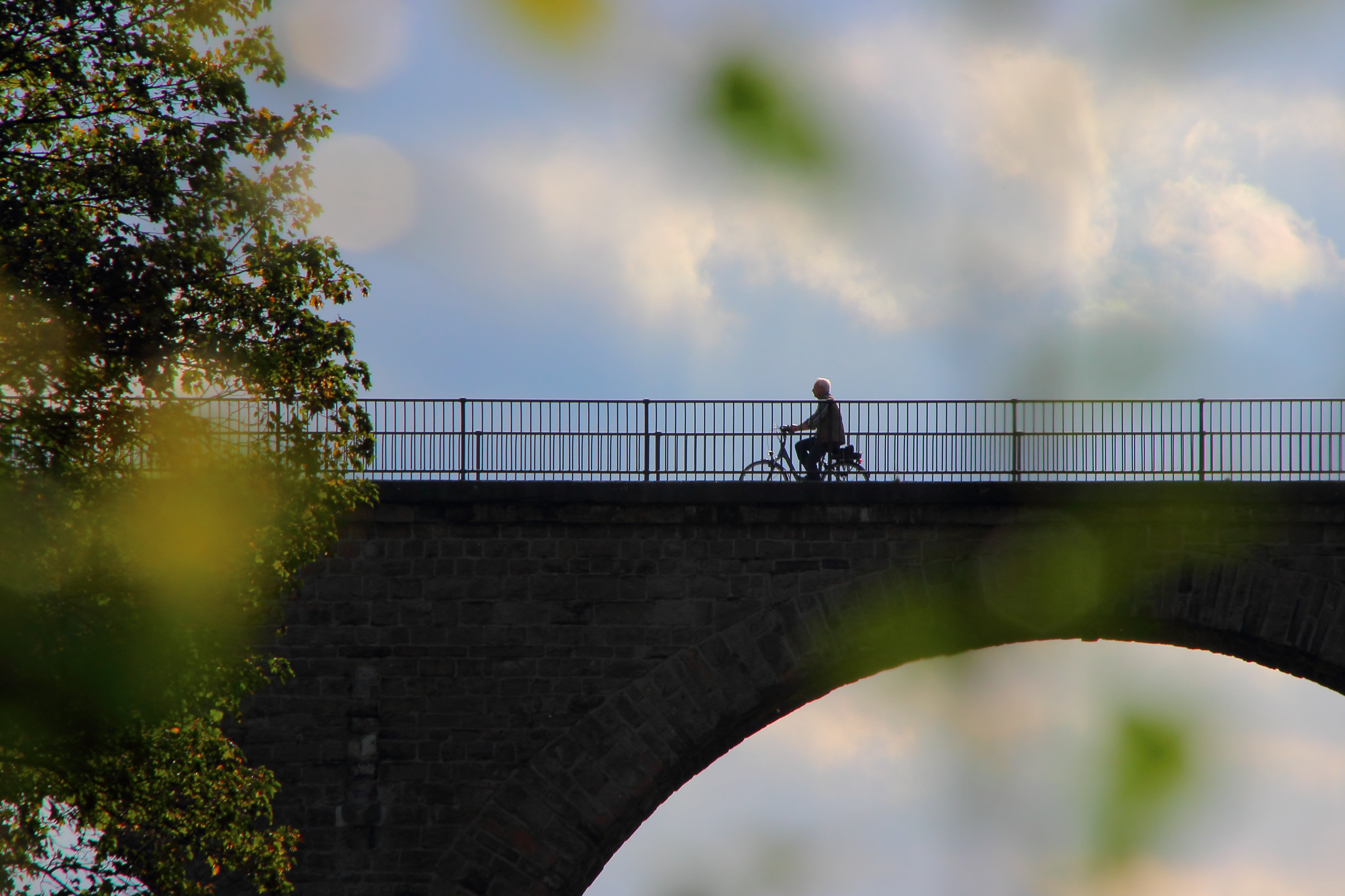 architecture, railing, leisure activity, full length, footbridge, outdoors, bike, lifestyles, more, connection, cloud - sky, adult, tour, one person, cyclists, HD Wallpaper