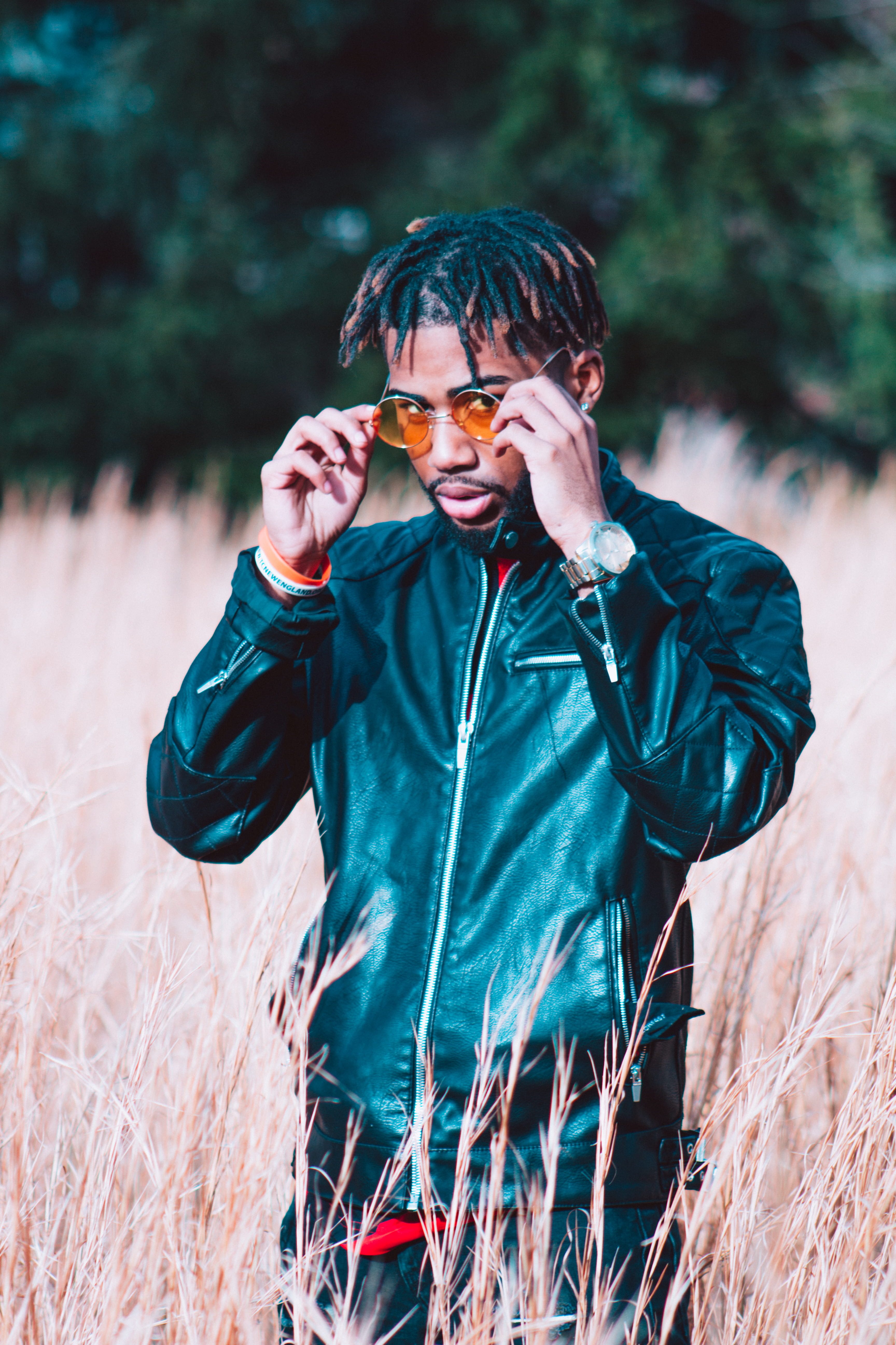 black, barrington, day, color, waist up, uzi, plant, real people, cold, glasses, one person, music, lifestyles, haircut, trap, grass, land, shadows, outdoors, Phone HD Wallpaper