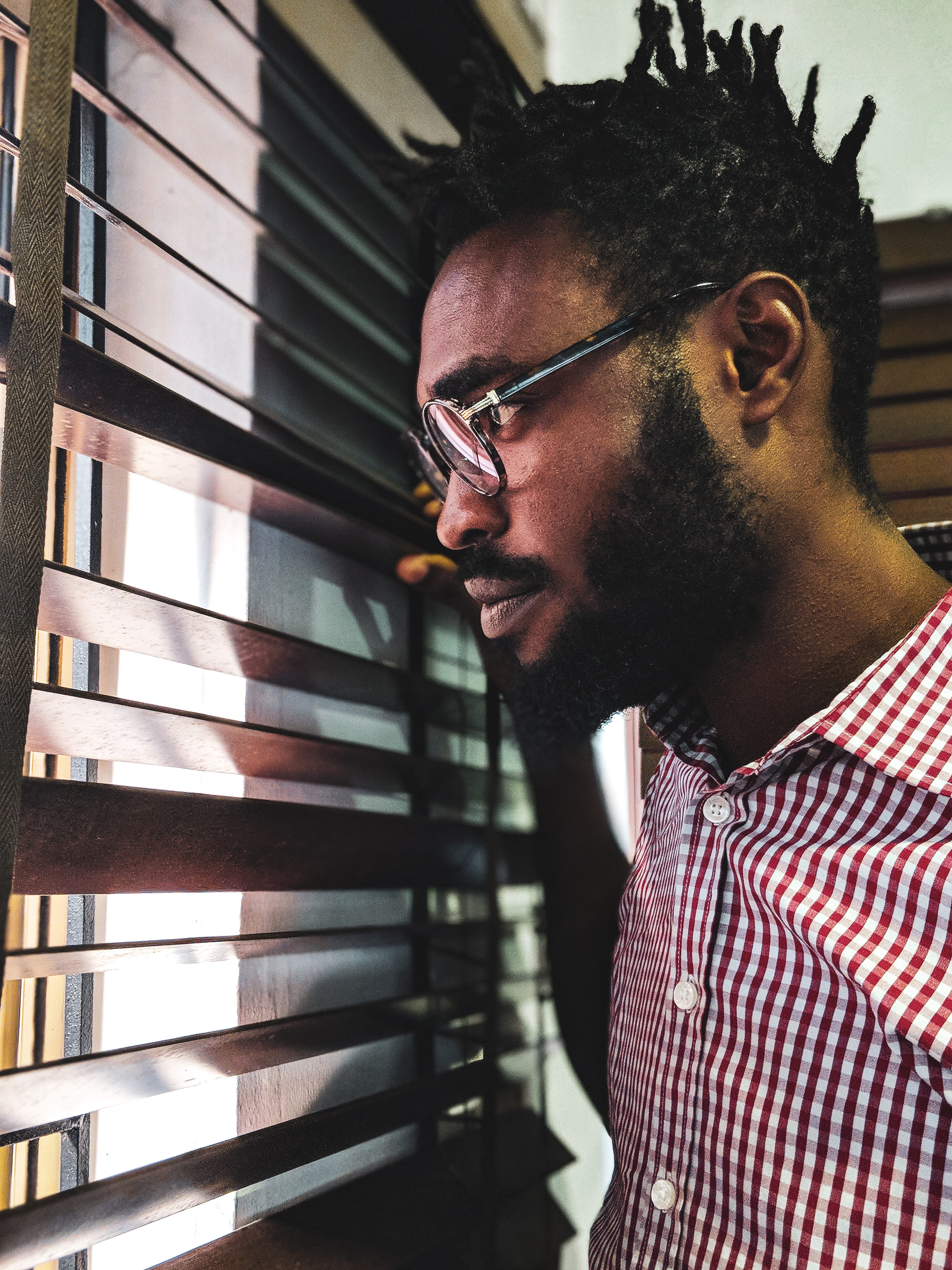 nigeria, eyeglass, man, room, looking, contemplation, one person, black, light, facial hair, side view, nigerian, pattern, house, serious, hairstyle, afternoon, Phone HD Wallpaper