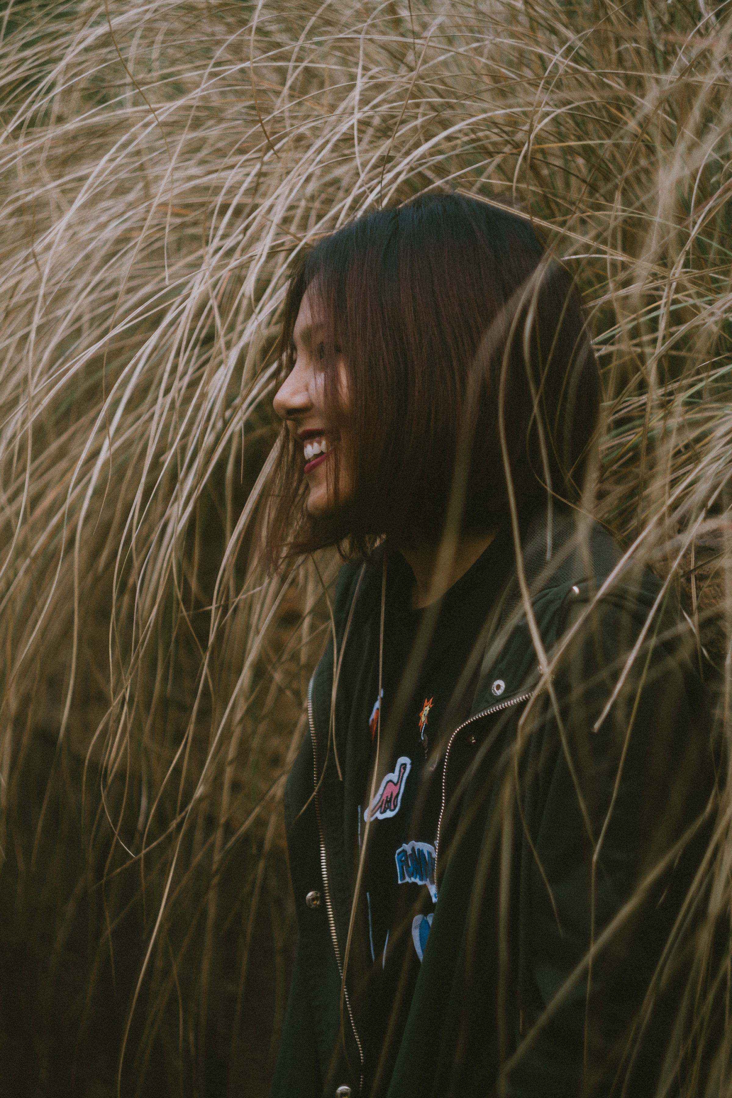 sideways, waist up, jacket, 2K, woman, portrait, leisure activity, looking, nature, teenager, hair, day, field, one person, lifestyles, land, outdoors, Phone HD Wallpaper