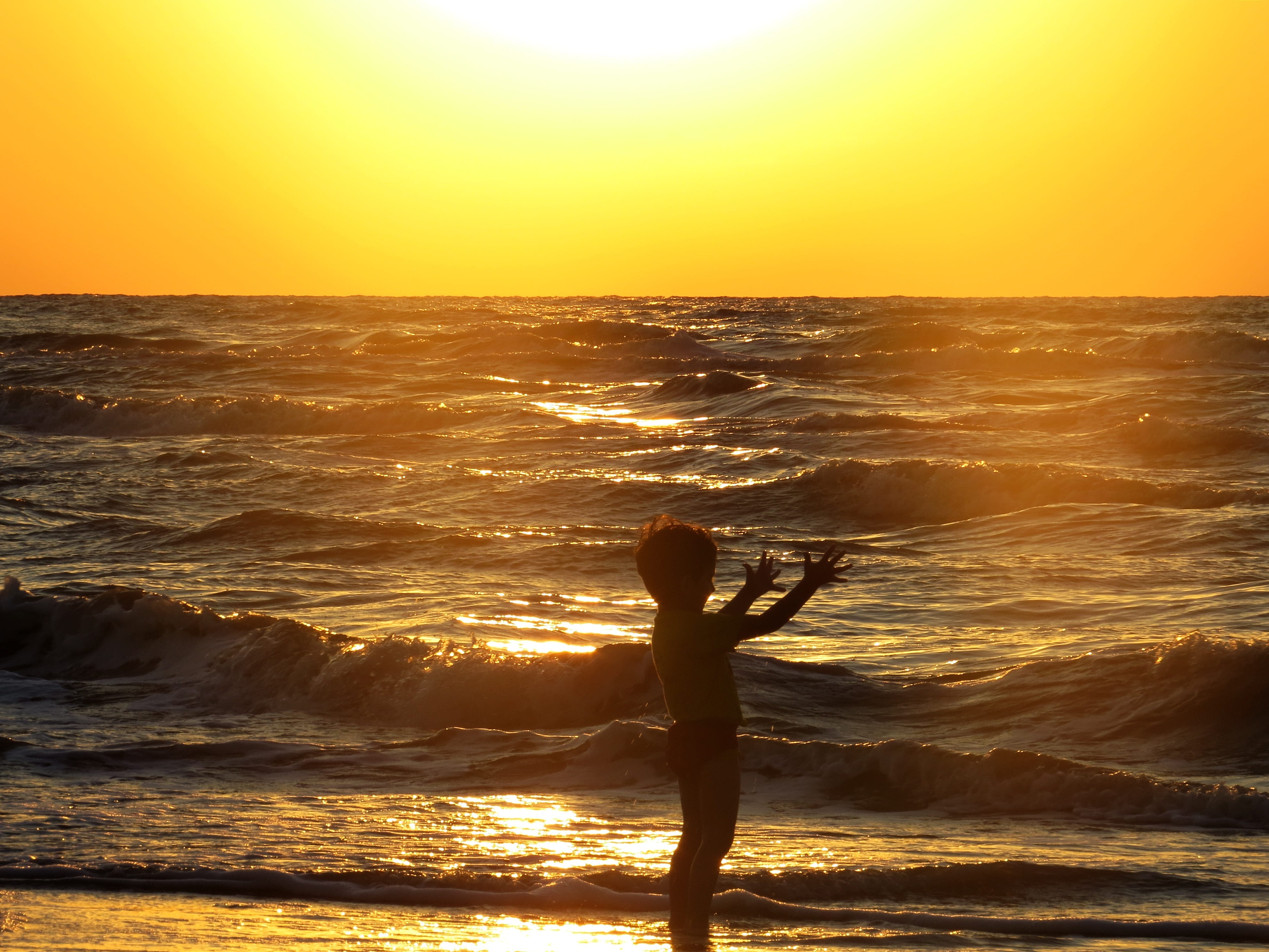 shore, water, beauty in nature, sky, horizon, orange color, horizon over water, child, ocean, real people, boy, arms raised, human arm, sunrise, leisure activity, HD Wallpaper