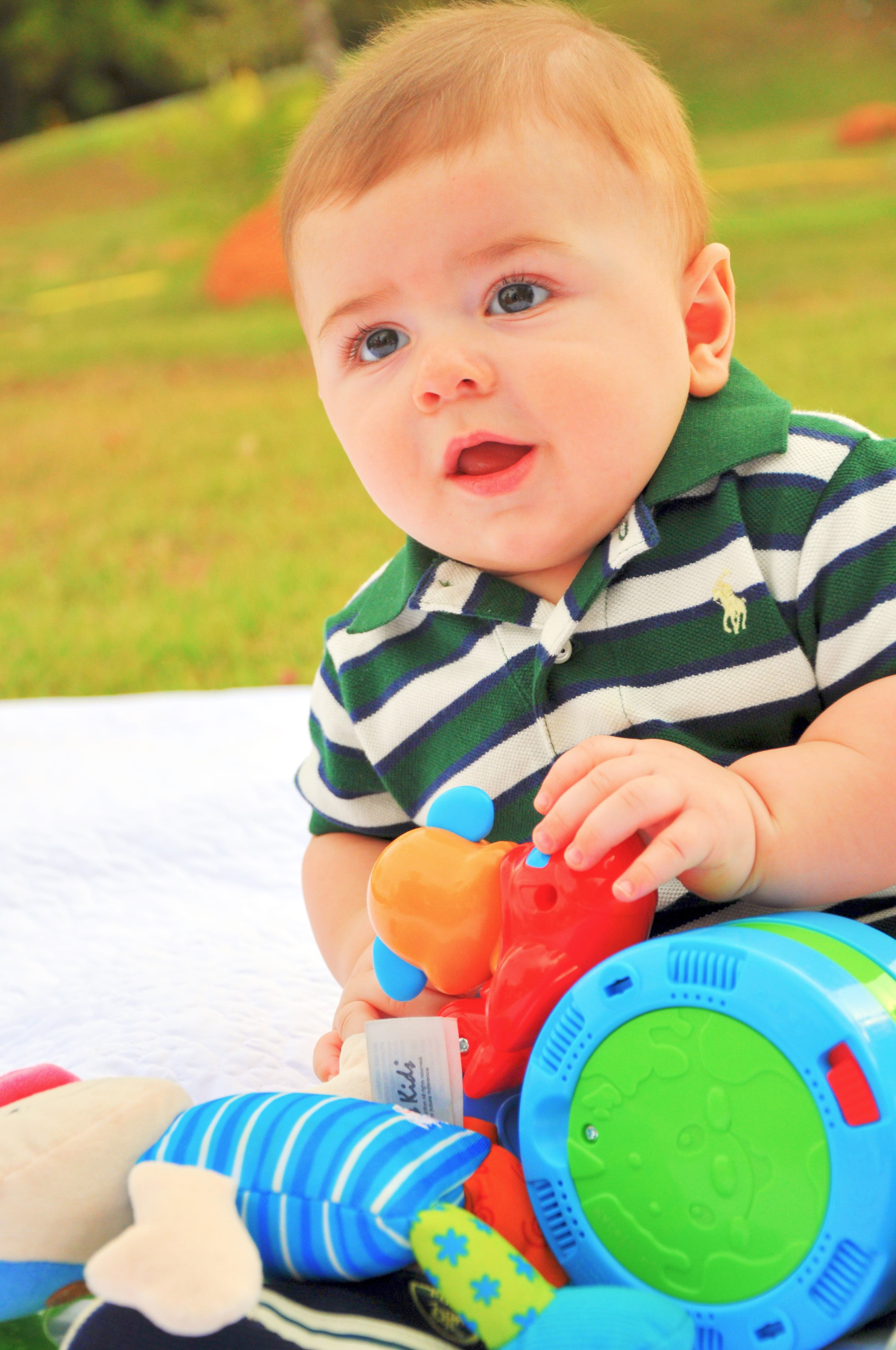 outdoors, toys, baby, mouth open, real people, todler, sitting, cute, bebe, striped, one person, lifestyles, front view, toddler, 4K, kid, daytime, polo shirt, Phone HD Wallpaper