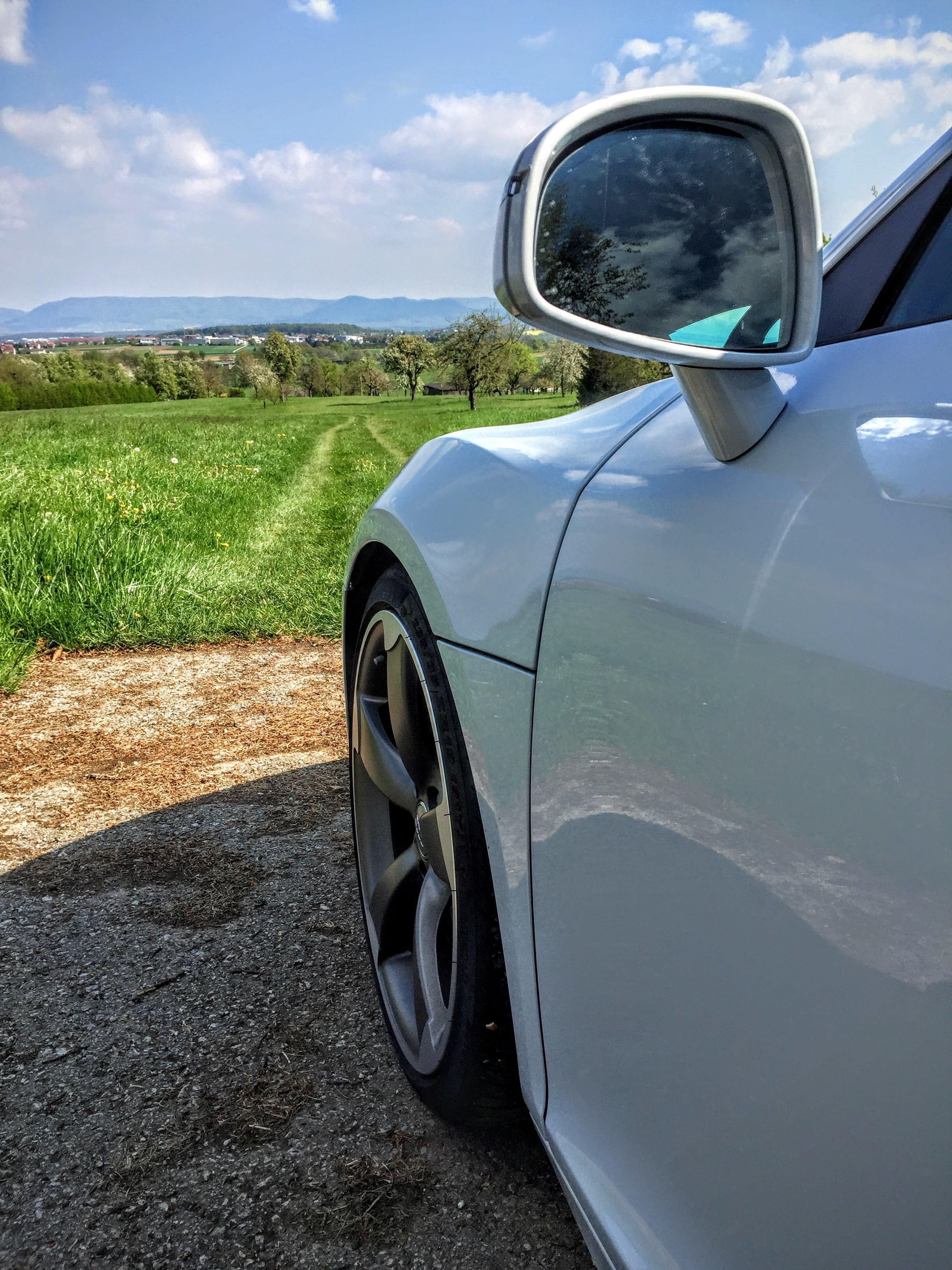 2K, mode of transportation, field, plant, sports car, summer day, background, environment, wheel, summer, sun, reflection, automotive, day, vehicles, nature, Phone HD Wallpaper