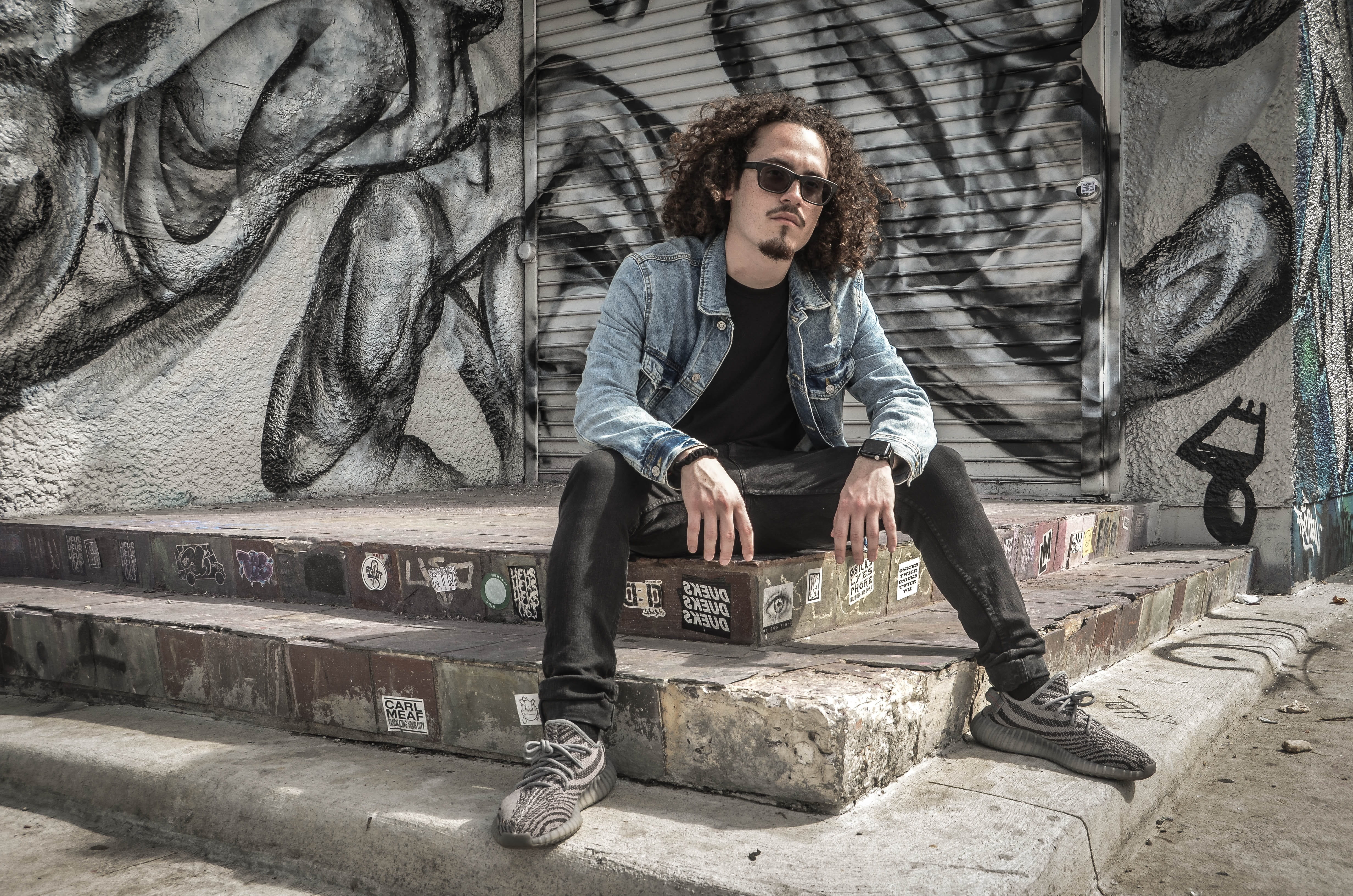 miami, young men, 4K, architecture, casual clothing, teens, fashion, men, sitting, built structure, wall - building feature, outdoor, one person, front view, HD Wallpaper