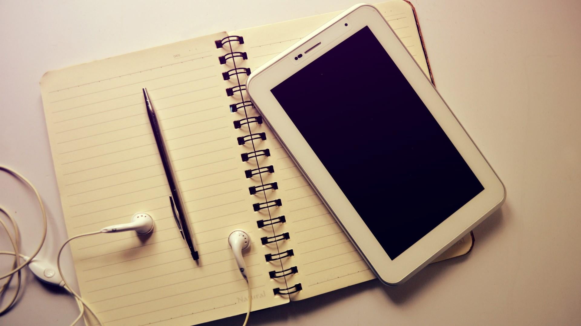 table, technology, spiral notebook, close-up, still life, ear phone, tablate, no people, open, education, 1080P, wireless technology, paper, communication, HD Wallpaper