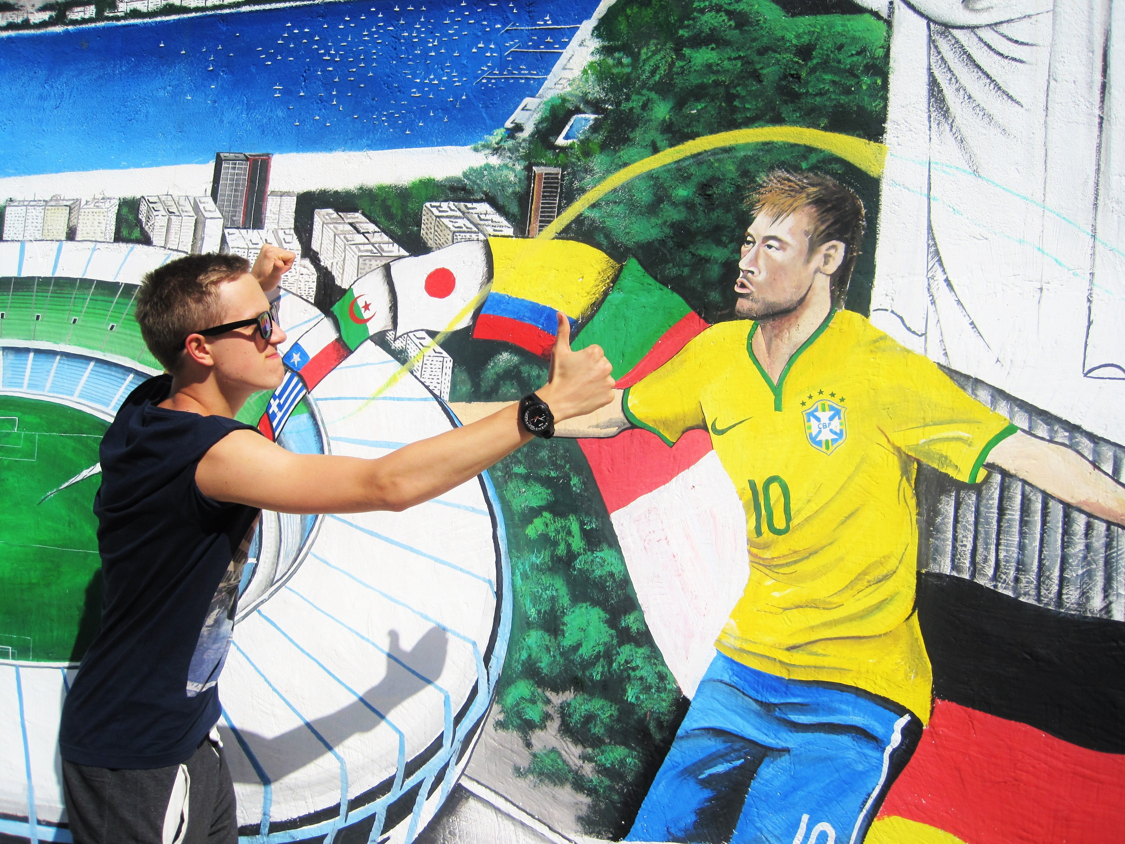 painted wall, males, holding, 2K, street art, graffiti, three quarter length, outdoors, modern art, götze against neymar, wm-victorious, men, glasses, HD Wallpaper
